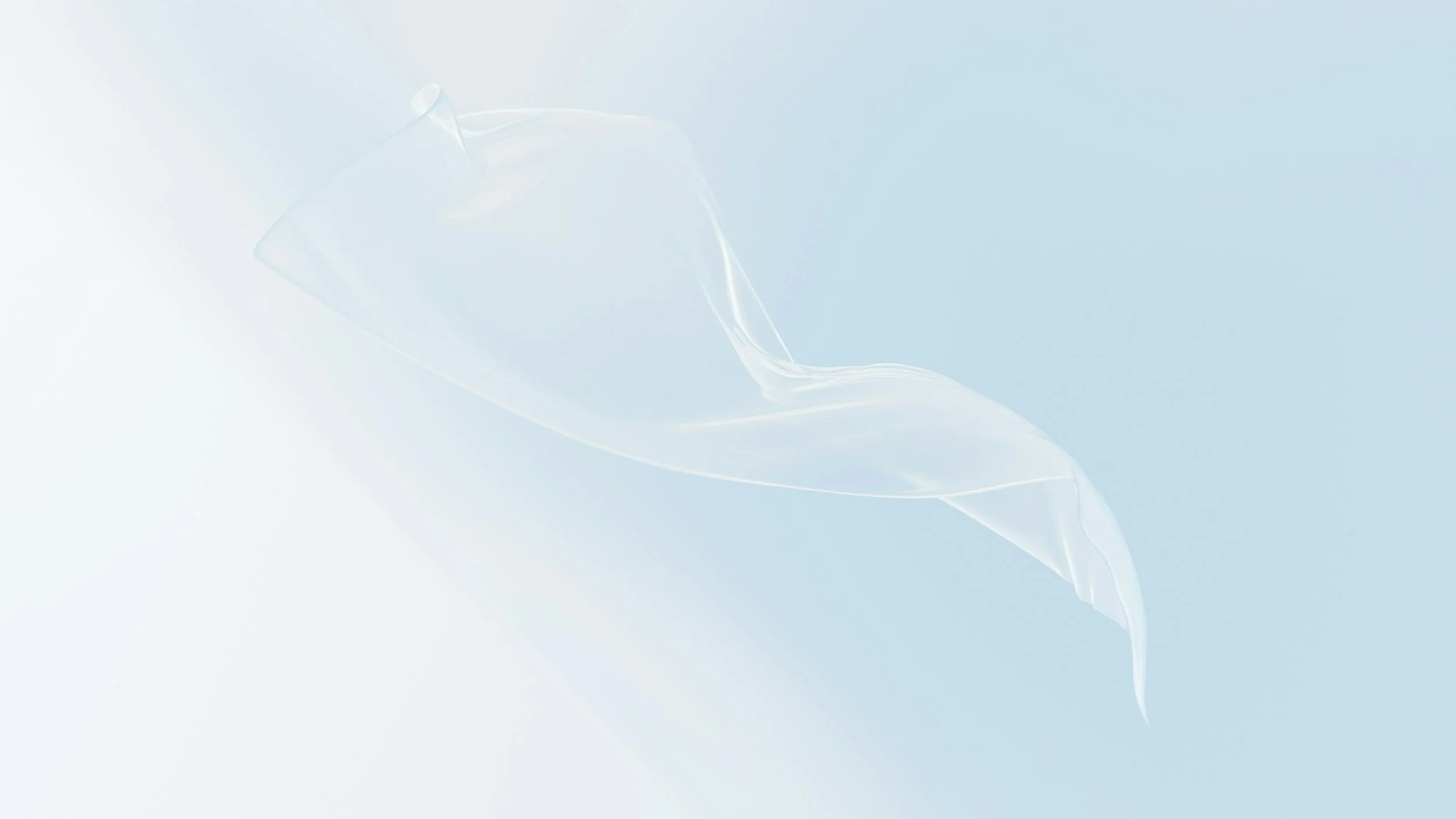 A close-up of a transparent plastic measuring cup spilling a clear liquid onto a light background.