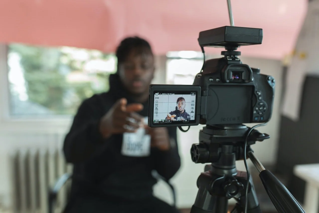 Man recording himself on camera. Attorney video marketing. source: nappy.com