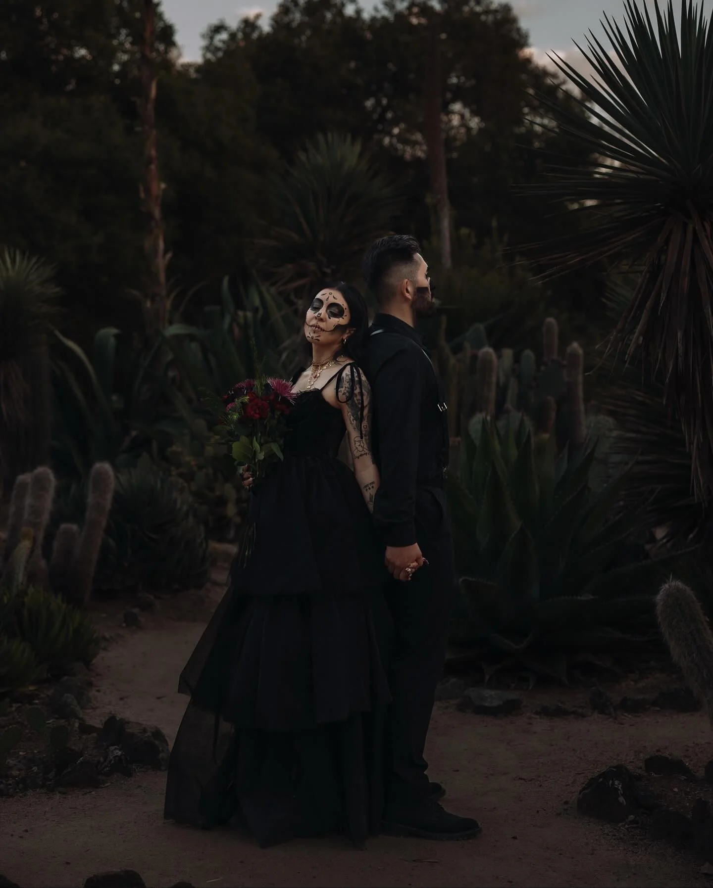 🖤Til death and beyond.🕯️✨
On the day these two say I do, I couldn&rsquo;t think of a better time to share their engagement session: a dark + moody D&iacute;a de los Muertos&ndash;inspired love story captured at the surreal Arizona Cactus Garden.

E