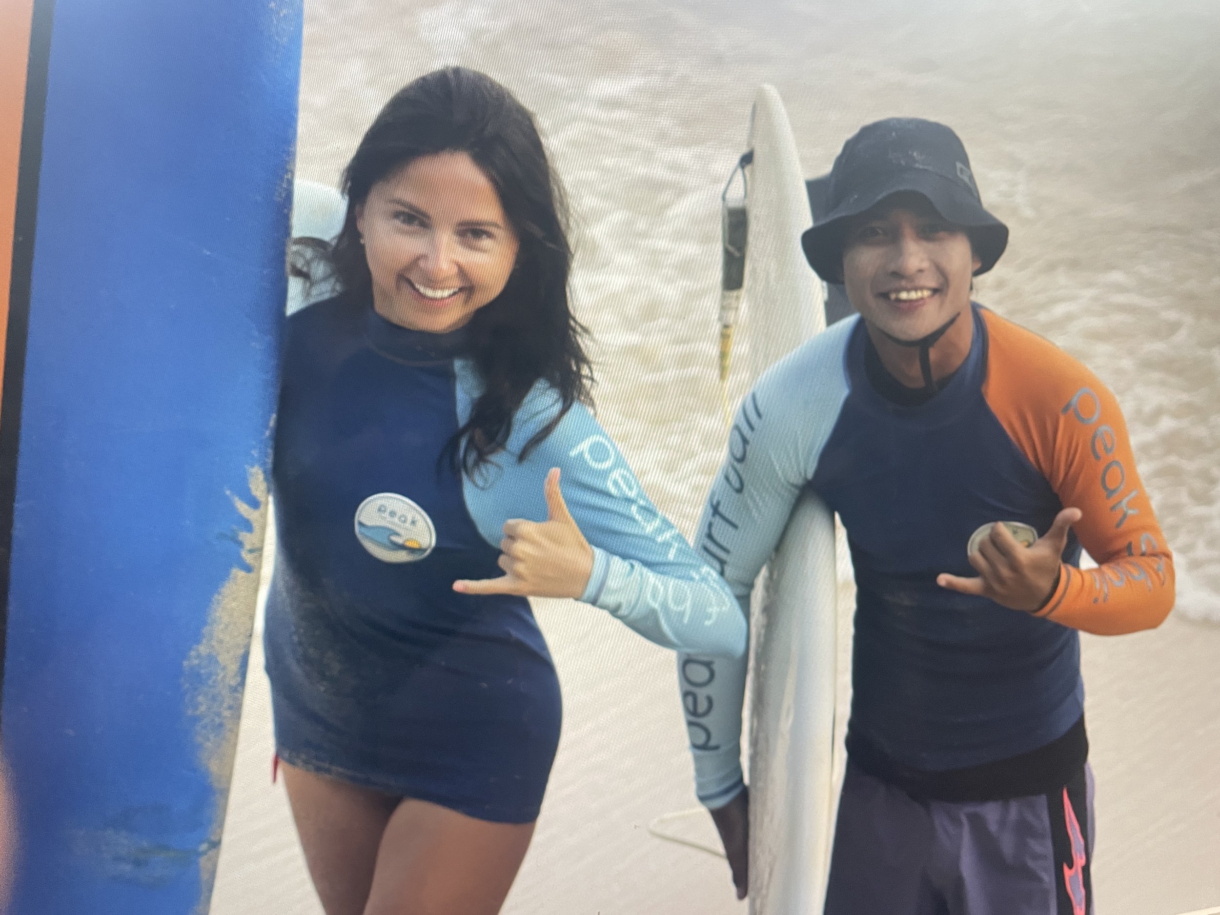 Peak Surf Bali Students at Padang Padang Beach Uluwatu Surfing Peak Surf Bali Surf School high five smiles fun happy joy friendship surfing beautiful beach crystal clear water white sand teaching surf surfer girl