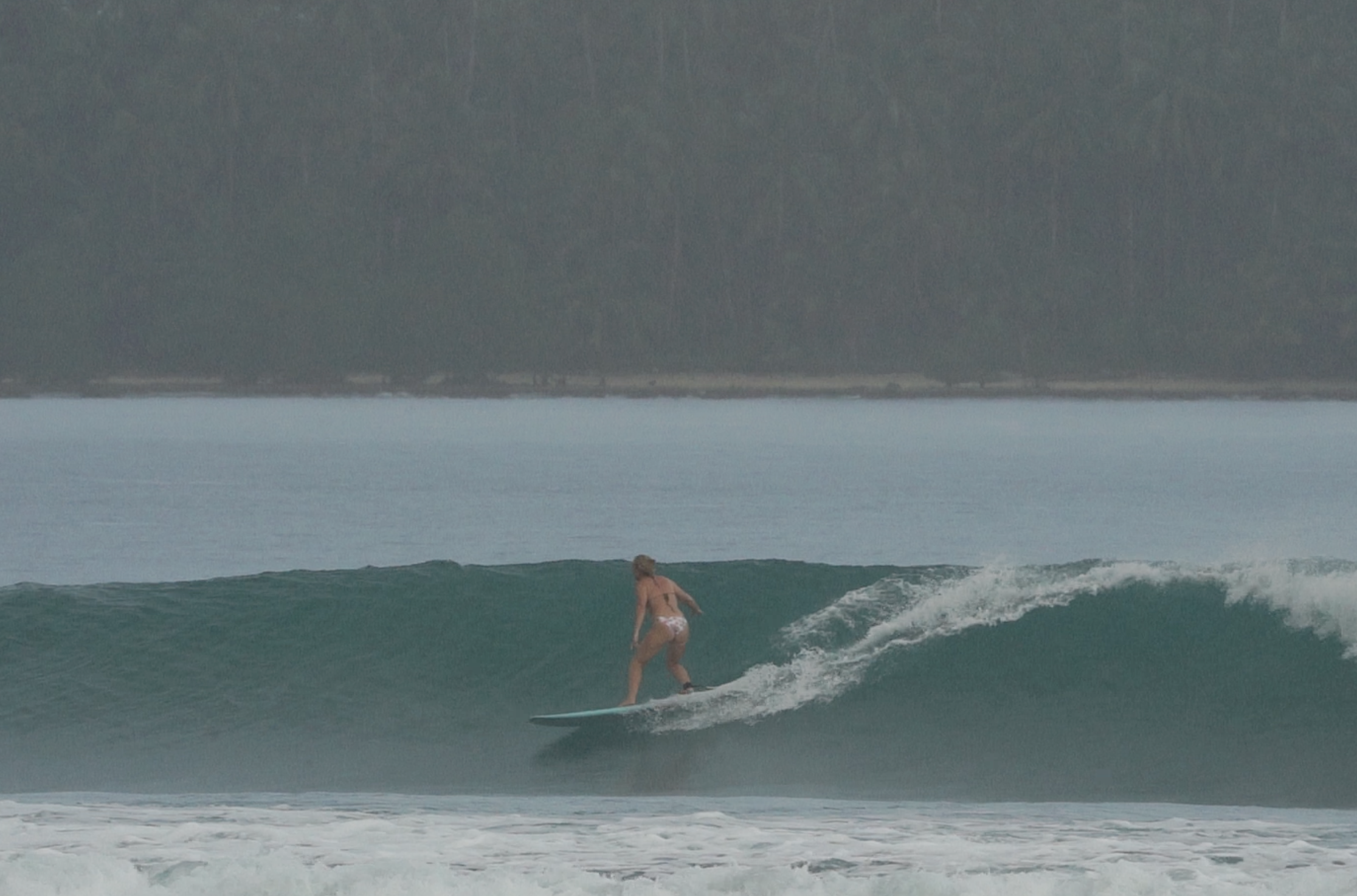 Peak Surf Bali Students at Nias Island North Sumatra, Uluwatu Surfing Peak Surf Bali Surf School high five smiles fun happy joy friendship surfing beautiful beach crystal clear water white sand teaching surf surfer girl