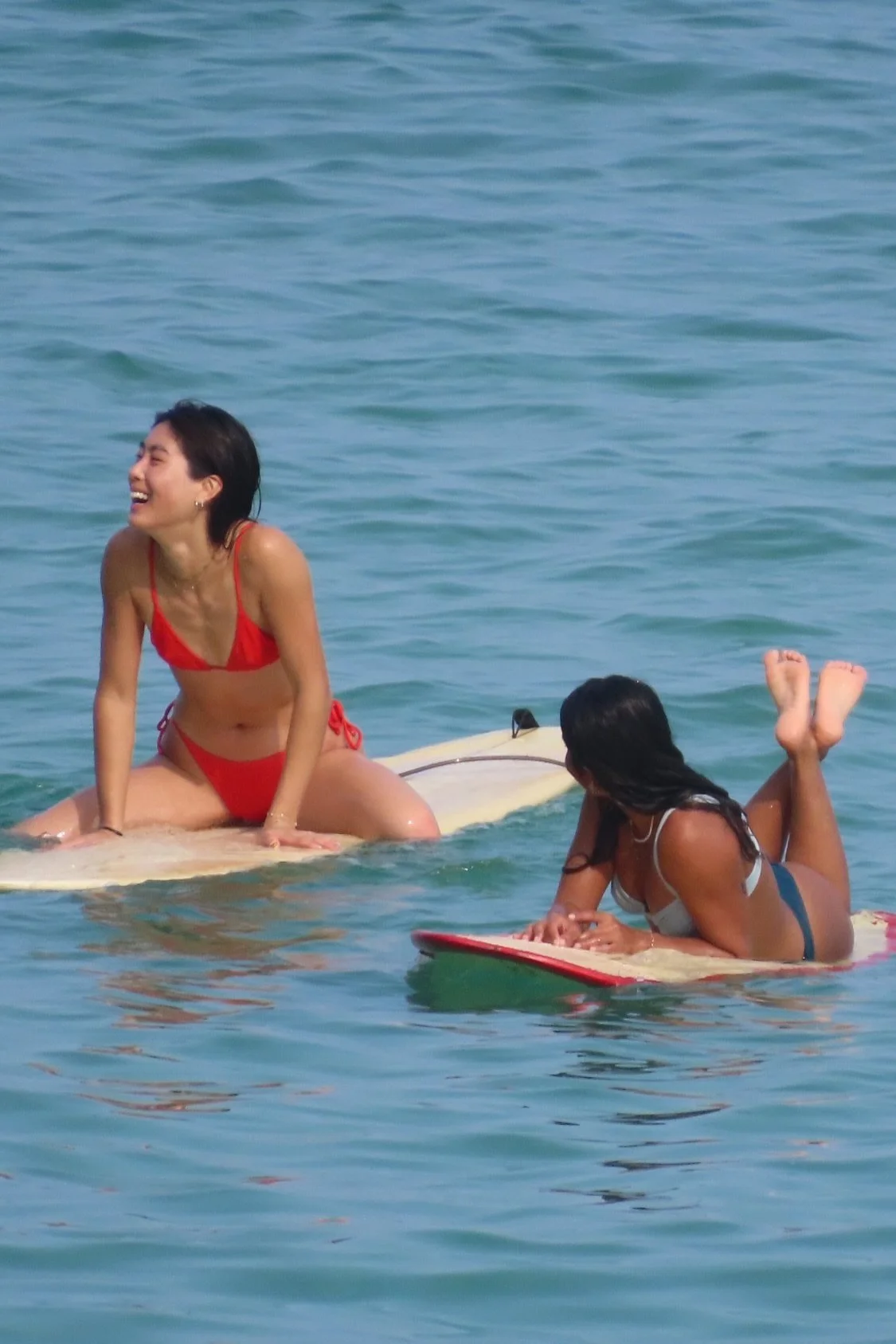 Peak Surf Bali Students at Padang Padang Beach Uluwatu Surfing Peak Surf Bali Surf School high five smiles fun happy joy friendship surfing beautiful beach crystal clear water white sand Longboarders