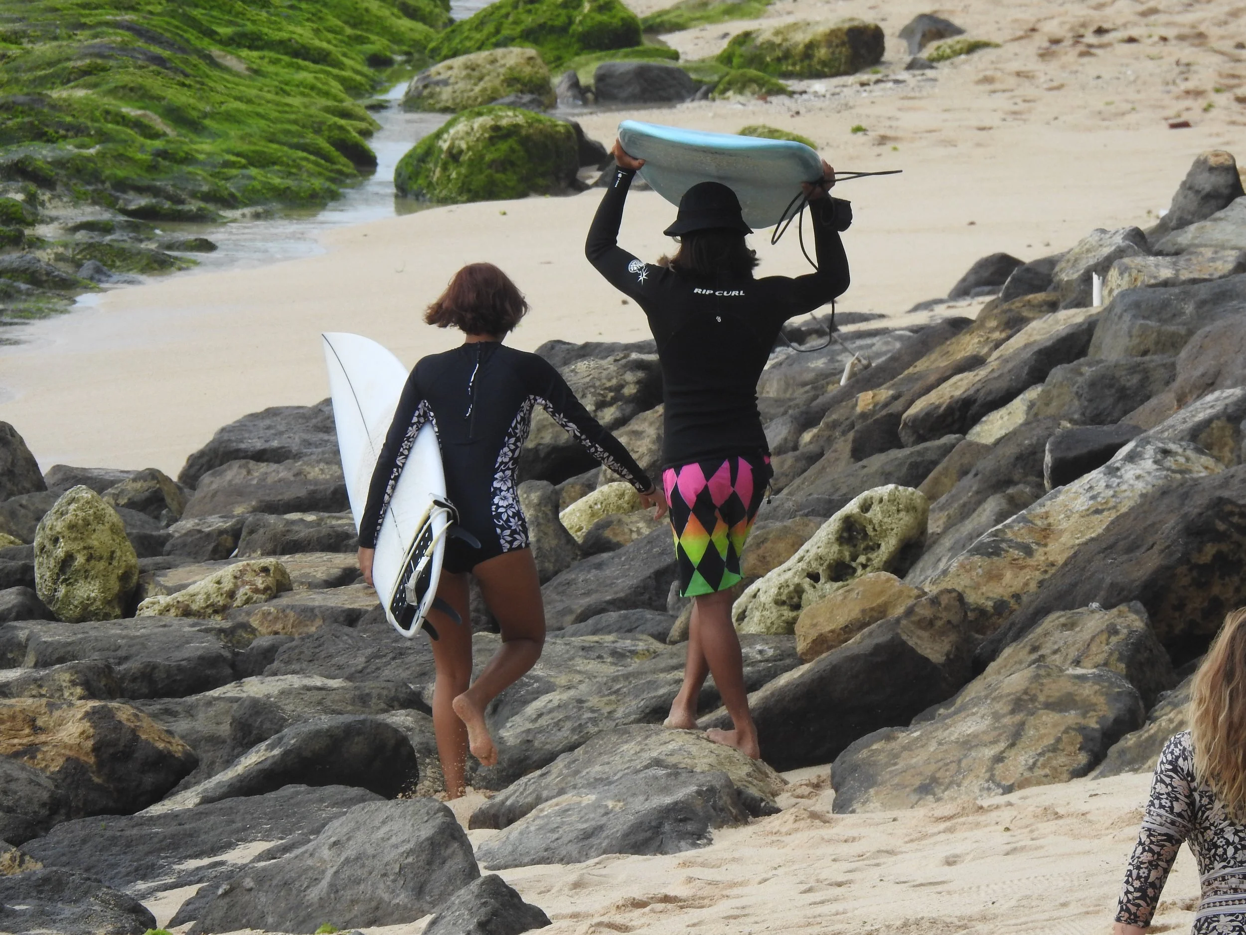 Rym Renom France French Peak Surf Bali Students at Padang Padang Beach Uluwatu Surfing Peak Surf Bali Surf School high five smiles fun happy joy friendship surfing beautiful beach crystal clear water white sand celebrity pink teaching surf surfer gir