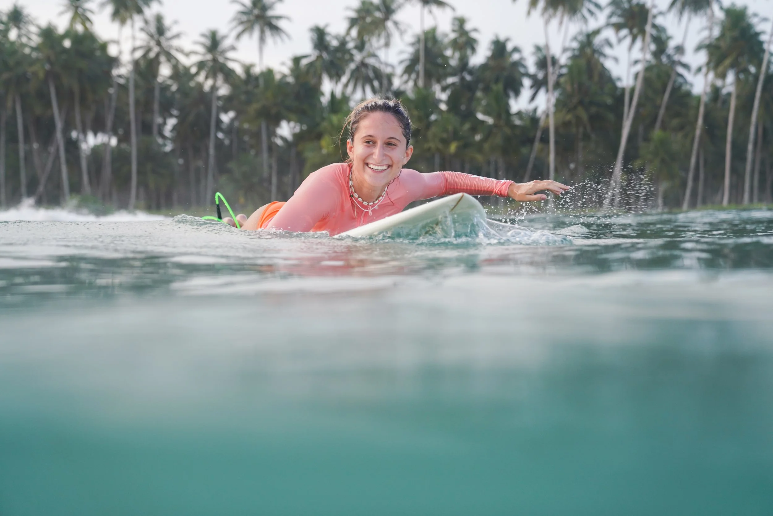 peak surf bali student paddling