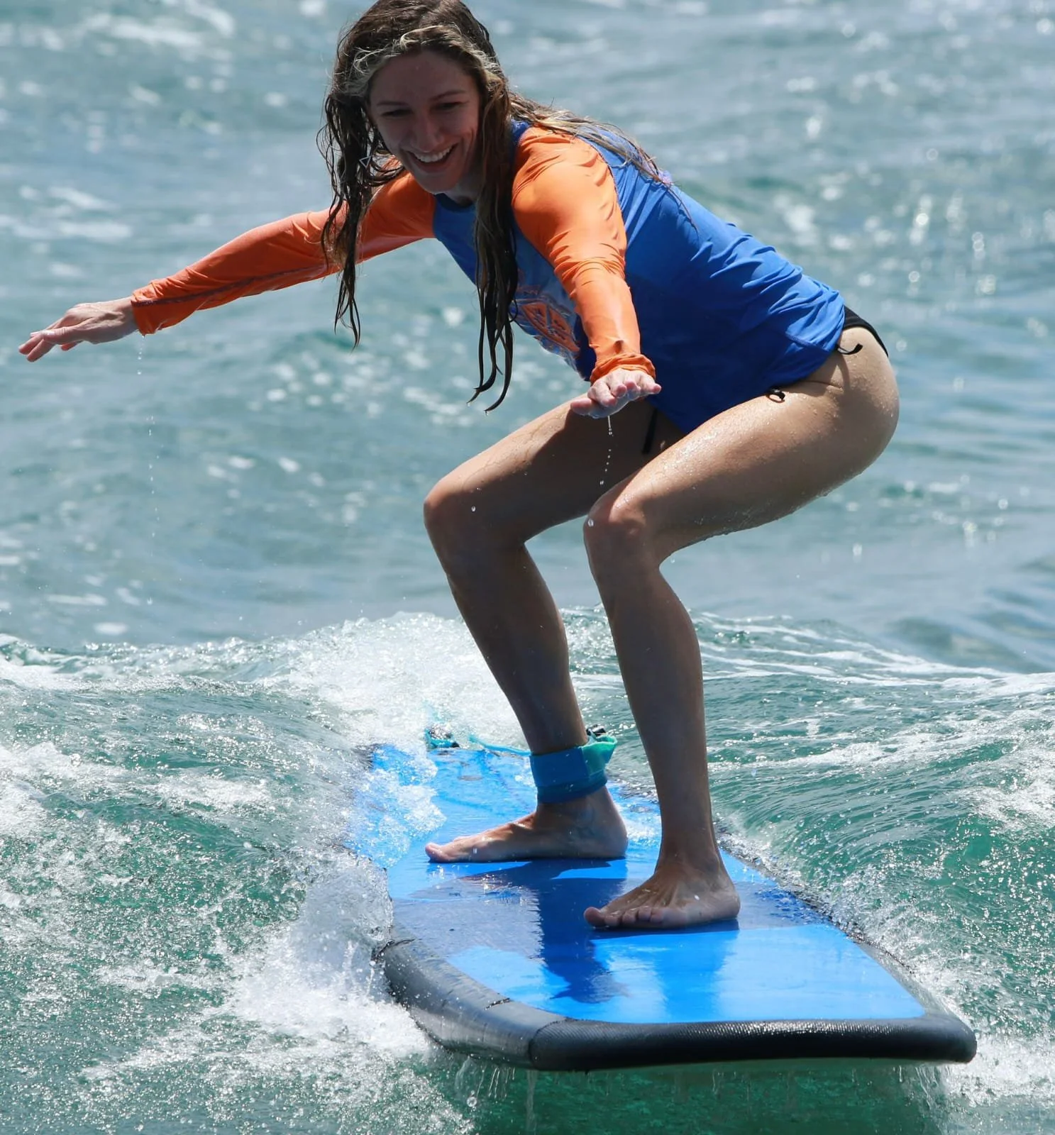 Peak Surf Bali Students at Padang Padang Beach Uluwatu Surfing Peak Surf Bali Surf School high five smiles fun happy joy friendship surfing beautiful beach crystal clear water white sand teaching surf surfer girl