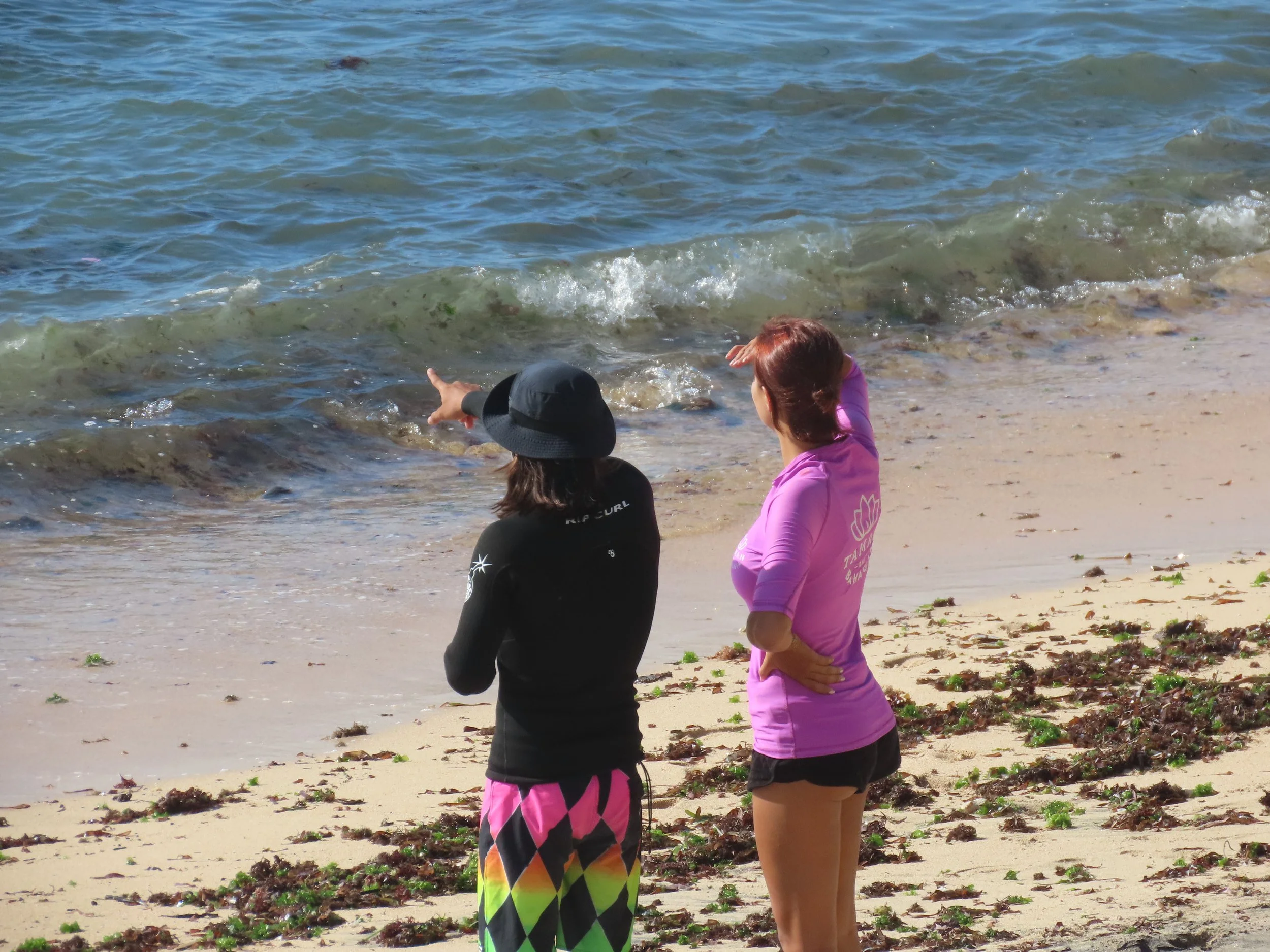 Rym Renom France French Peak Surf Bali Students at Padang Padang Beach Uluwatu Surfing Peak Surf Bali Surf School high five smiles fun happy joy friendship surfing beautiful beach crystal clear water white sand celebrity pink teaching surf surfer gir