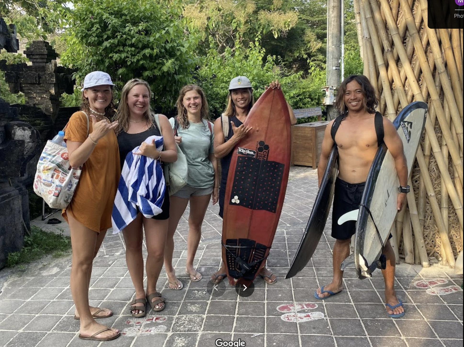 Peak Surf Bali Students at Padang Padang Beach Uluwatu Surfing Peak Surf Bali Surf School high five smiles fun happy joy friendship surfing beautiful beach crystal clear water white sand teaching surf surfer girl