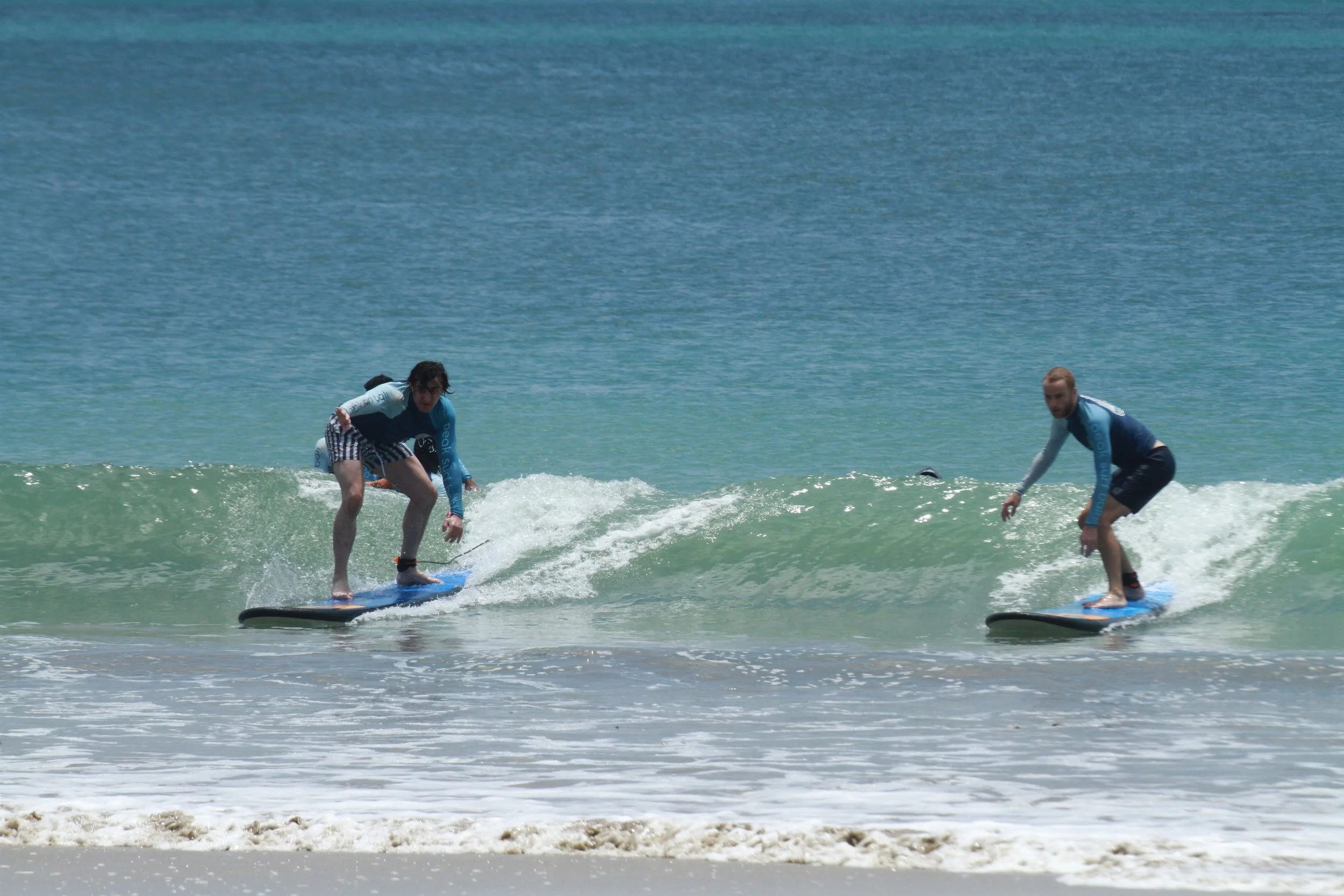 Group of Surf Students Solana Peak Surf Bali x After Break Point at Jimbaran Beach! @solana @solanabreakpoint peak surf school bali happy joy friendhip students riding waves at Jimbaran Uluwatu 