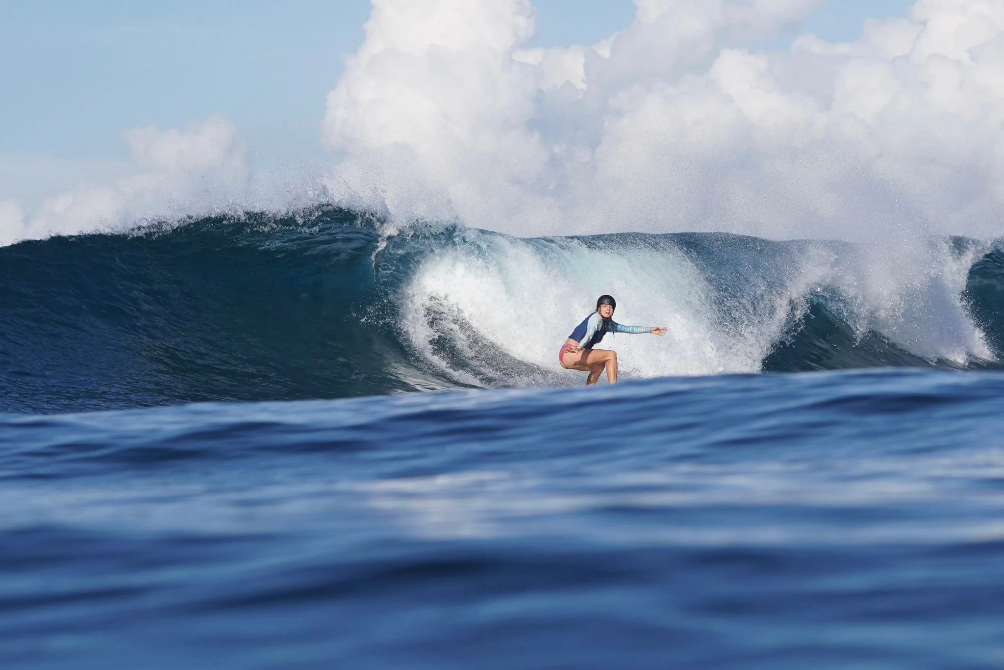 Lena Germany Portugal Peak Surf Bali Students at Padang Padang Beach Uluwatu Surfing Peak Surf Bali Surf School high five smiles fun happy joy friendship surfing beautiful beach crystal clear water white sand teaching surf surfer girl
