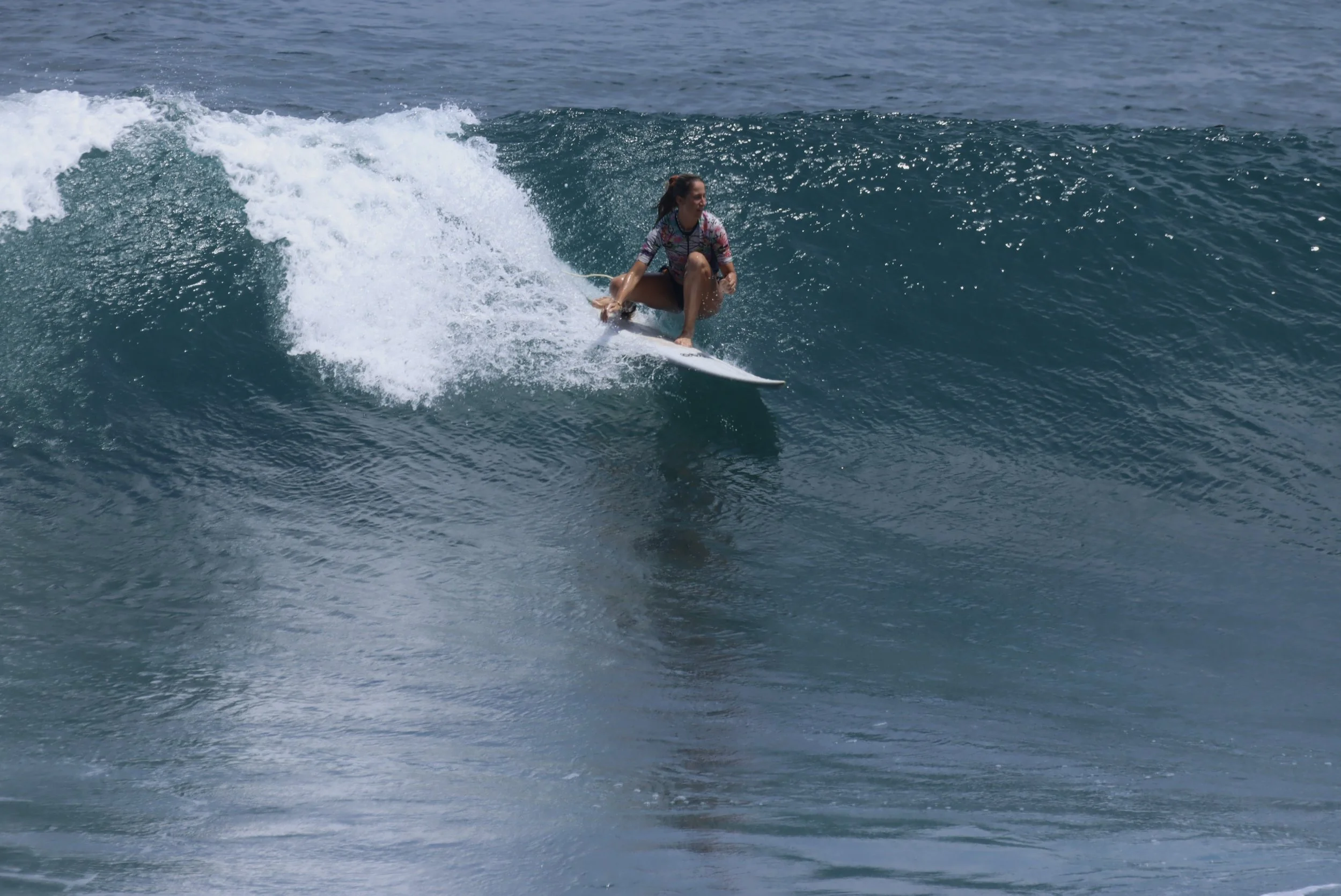 France French Student Surfer Peak Surf Bali Students at Padang Padang Beach Uluwatu Surfing Peak Surf Bali Surf School high five smiles fun happy joy friendship surfing beautiful beach crystal clear water white sand French student intermediate surf l