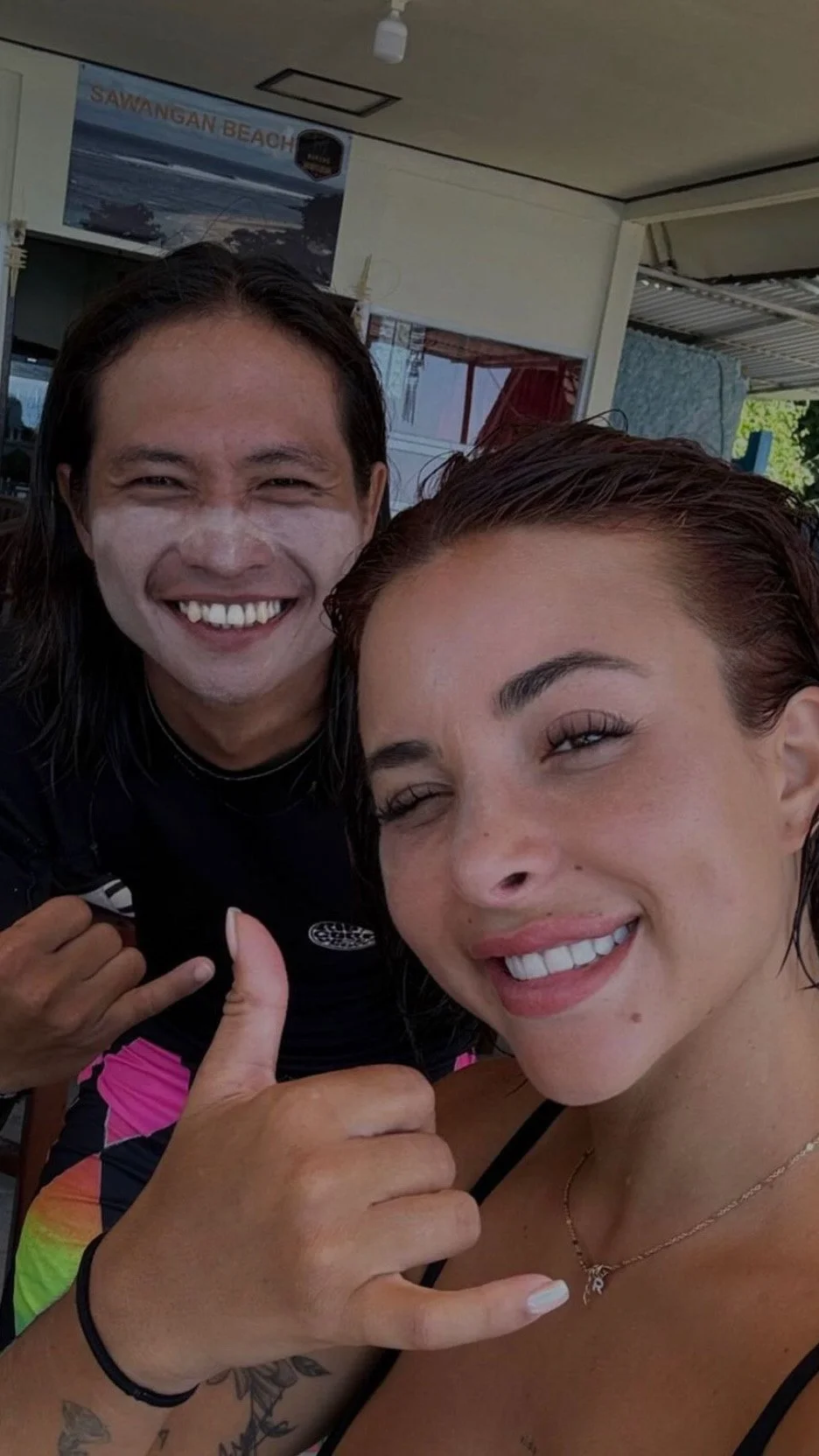 Rym Renom France French Peak Surf Bali Students at Padang Padang Beach Uluwatu Surfing Peak Surf Bali Surf School high five smiles fun happy joy friendship surfing beautiful beach crystal clear water white sand celebrity pink teaching surf surfer gir