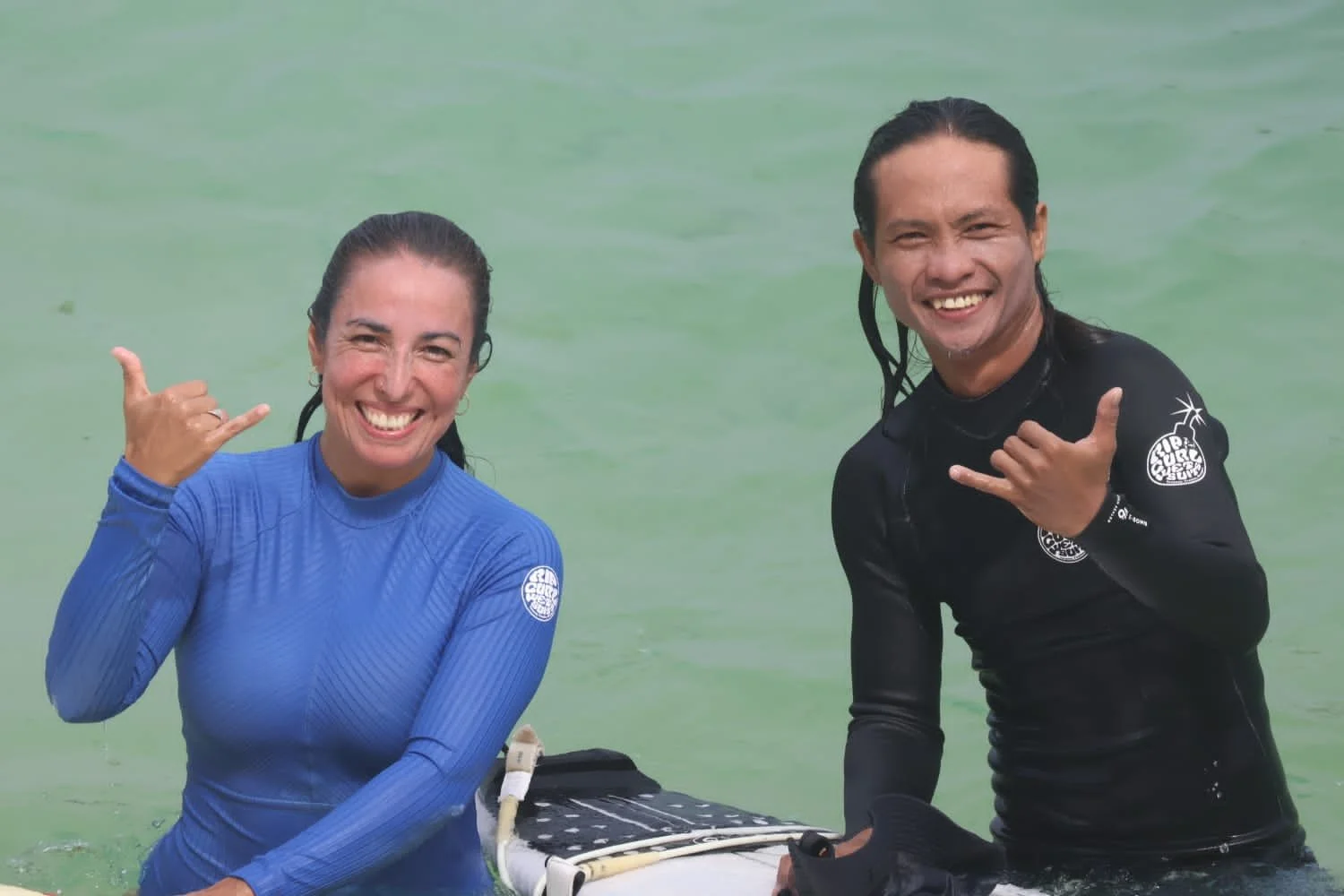 Peak Surf Bali Students at Padang Padang Beach Uluwatu Surfing Peak Surf Bali Surf School smiles fun happy joy friendship surfing beautiful beach crystal clear water white sand Longboarders