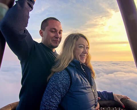 a couple enjoying a hot air balloon ride
