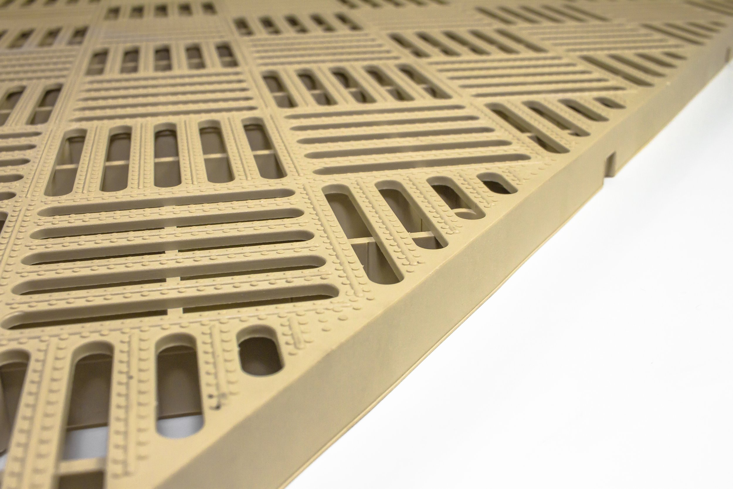 A beige plastic template with various rectangular and elongated slots, used for crafting or project measurements.