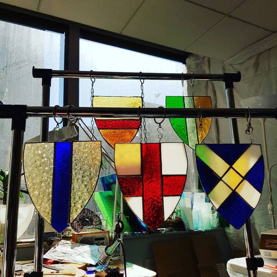 Heraldic shields in stained glass