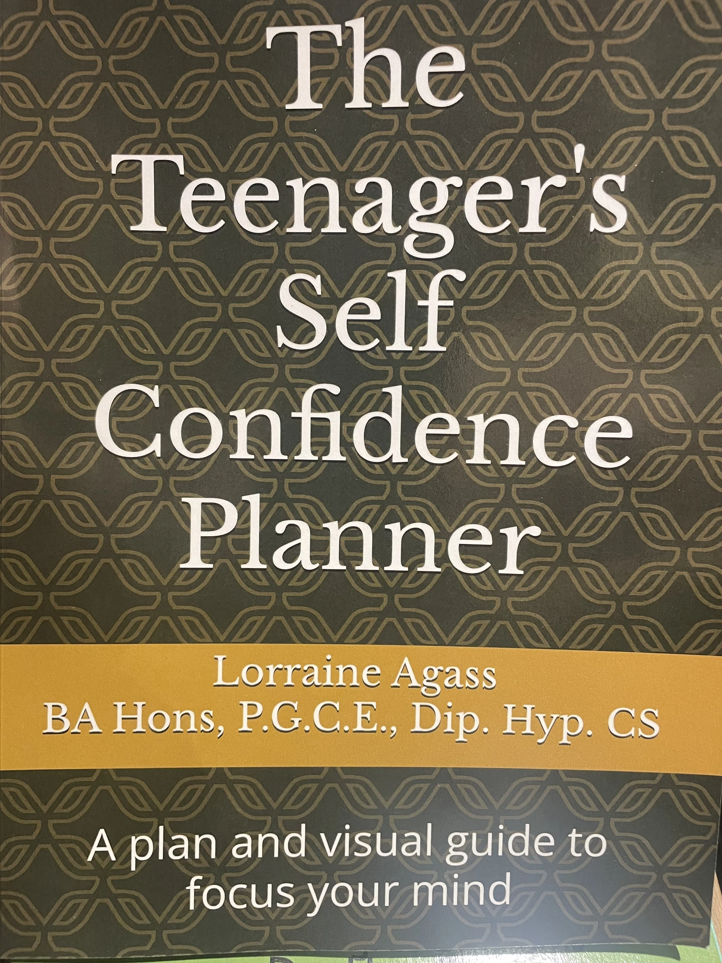 Book cover titled 'The Teenagers Self Confidence Planner' by Lorraine Agass, with the subtitle 'A plan and visual guide to focus your mind'.