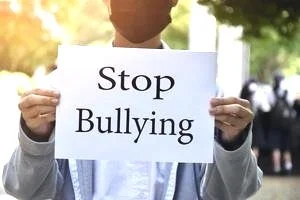 asian-boy-student-holds-white-paper-which-has-texts-stop-bullying-inside-concept-for-protesting-or-calling-out-all-people-around-the-world-to-stop-bullying-people-in-different-countries-photo.jpg