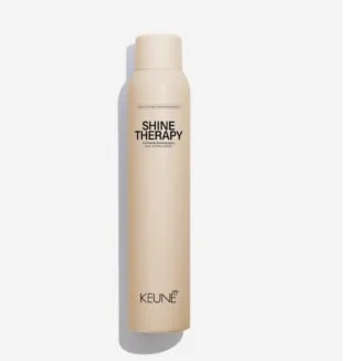 Bottle of Shine Therapy KEUNE hair product outside on a white background.