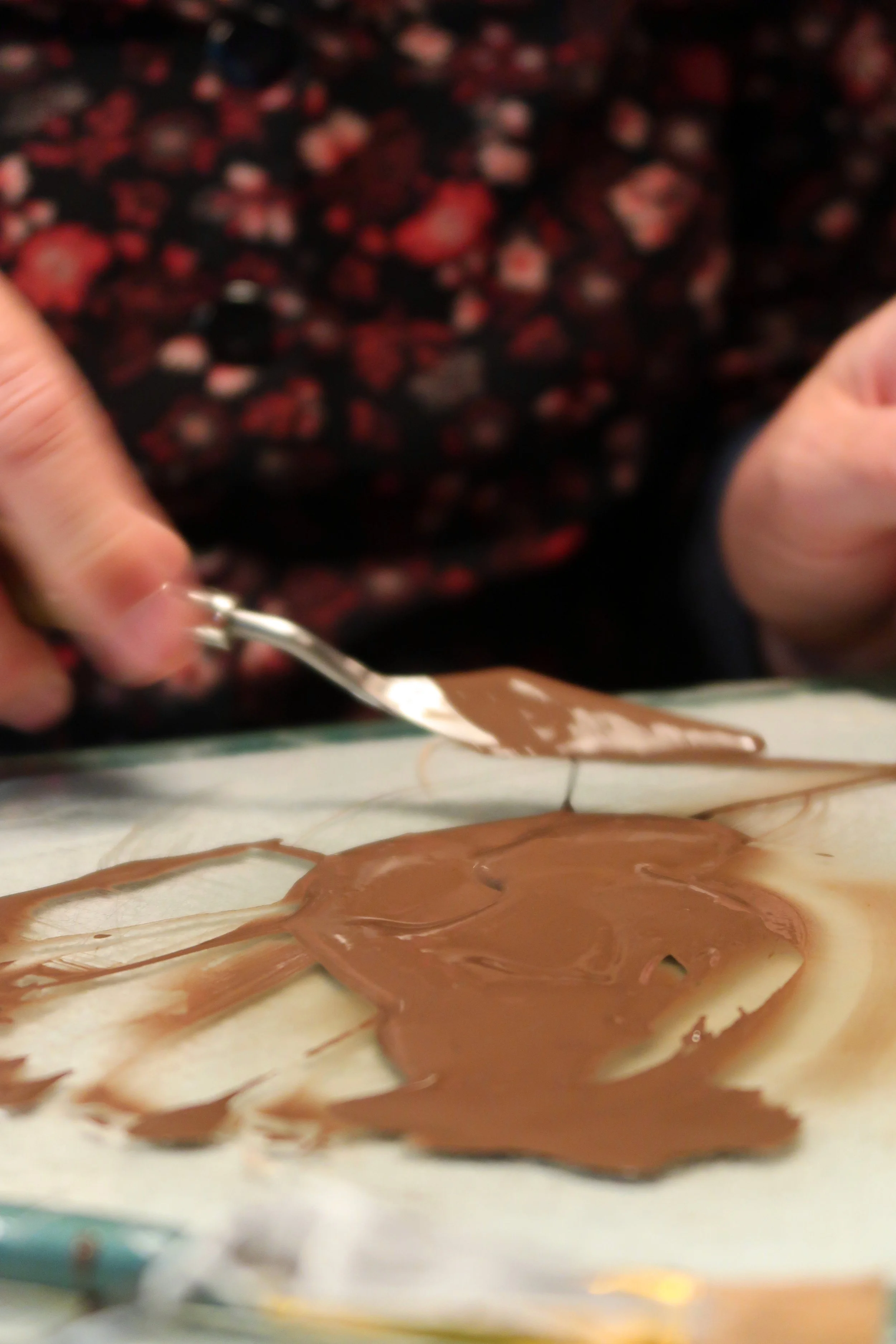 Close-up of a person working with pigment