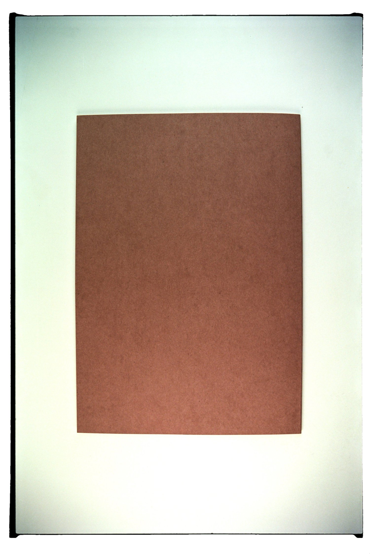 A brown rectangular object placed on a white background.