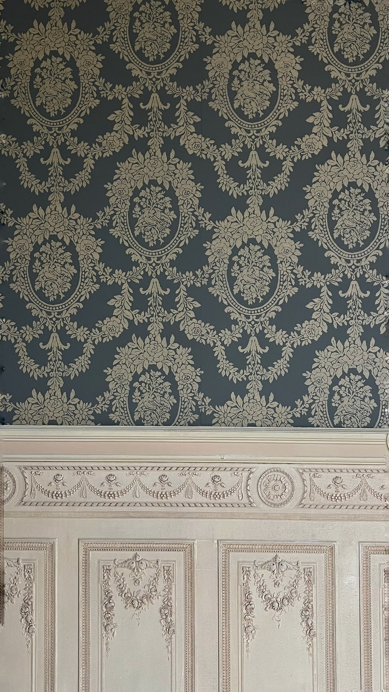 A damask pattern hung in a listed heritage house in Veurne