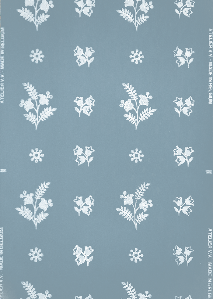 Pattern with white floral and snowflake designs on a blue background.