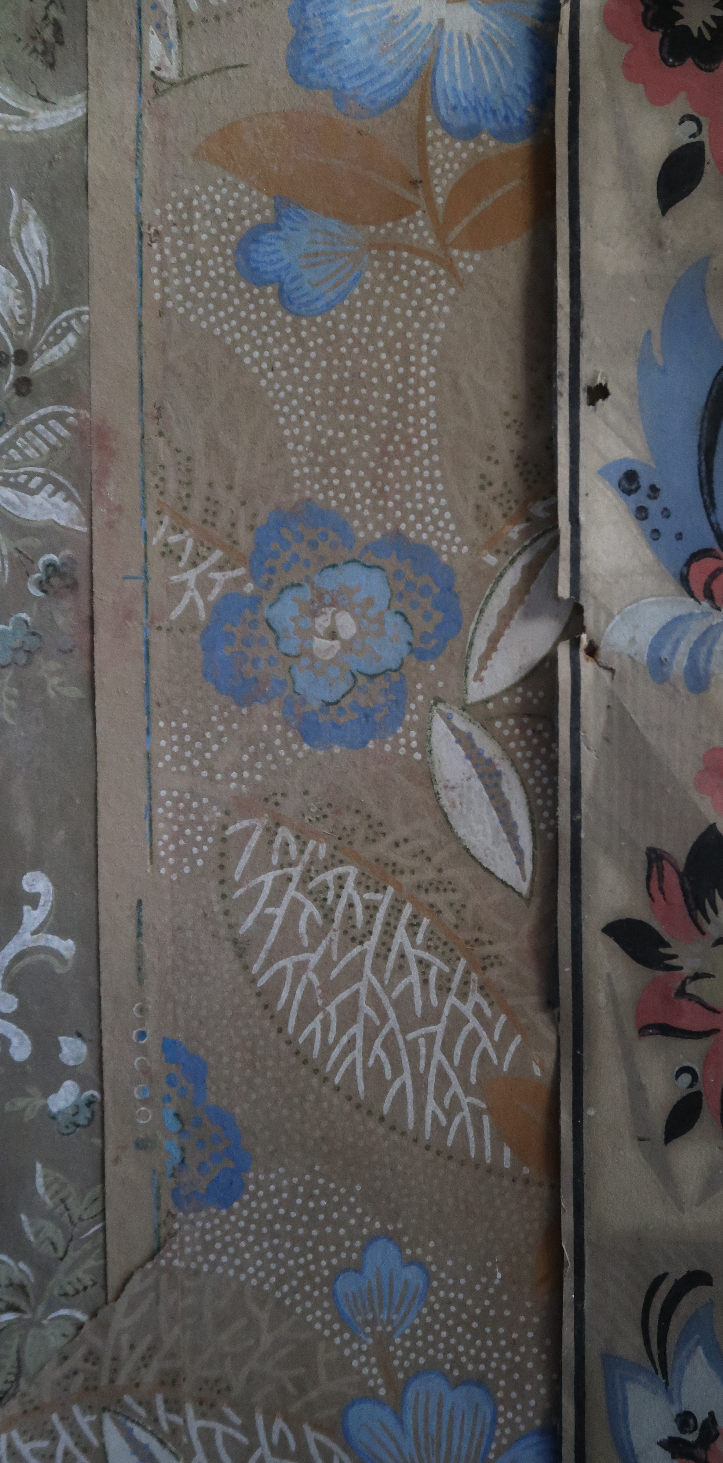 Decorative floral pattern with blue, pink, black, white, and beige colors, featuring flowers, leaves, and dotted details.
