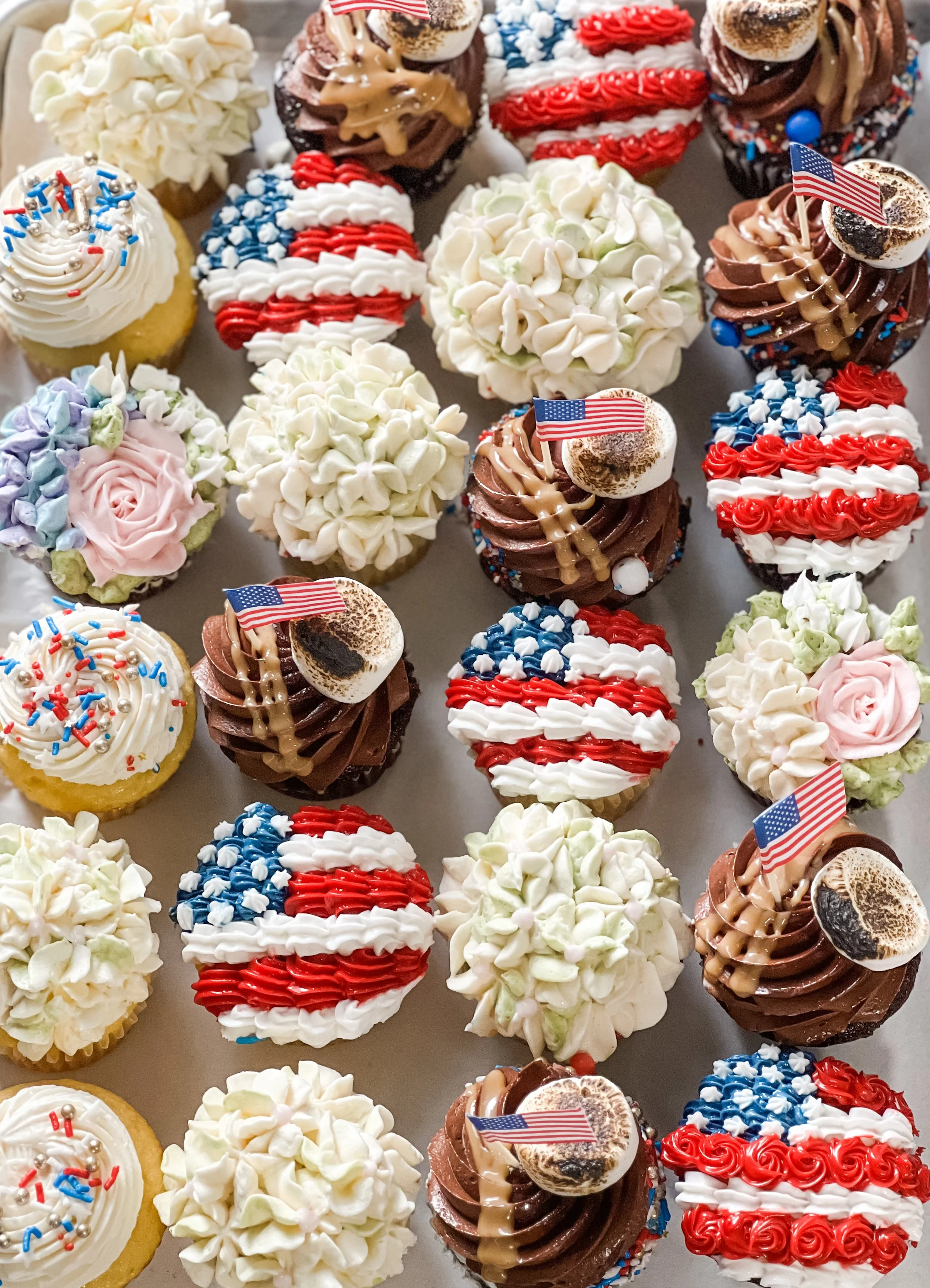 an array of cupcakes decorated for the fourth of july