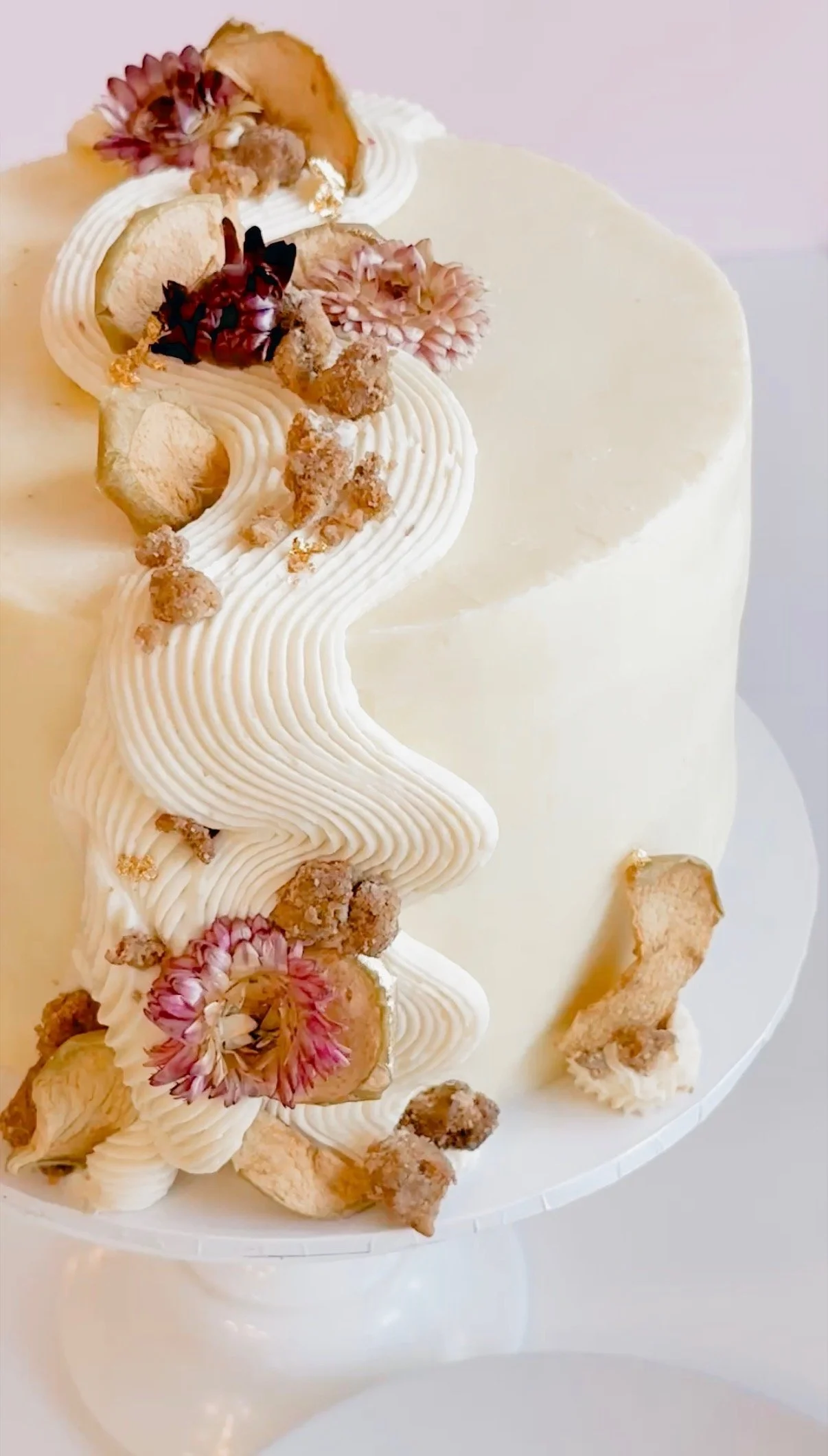 close up of the caramel apple cake showcasing ribboned icing