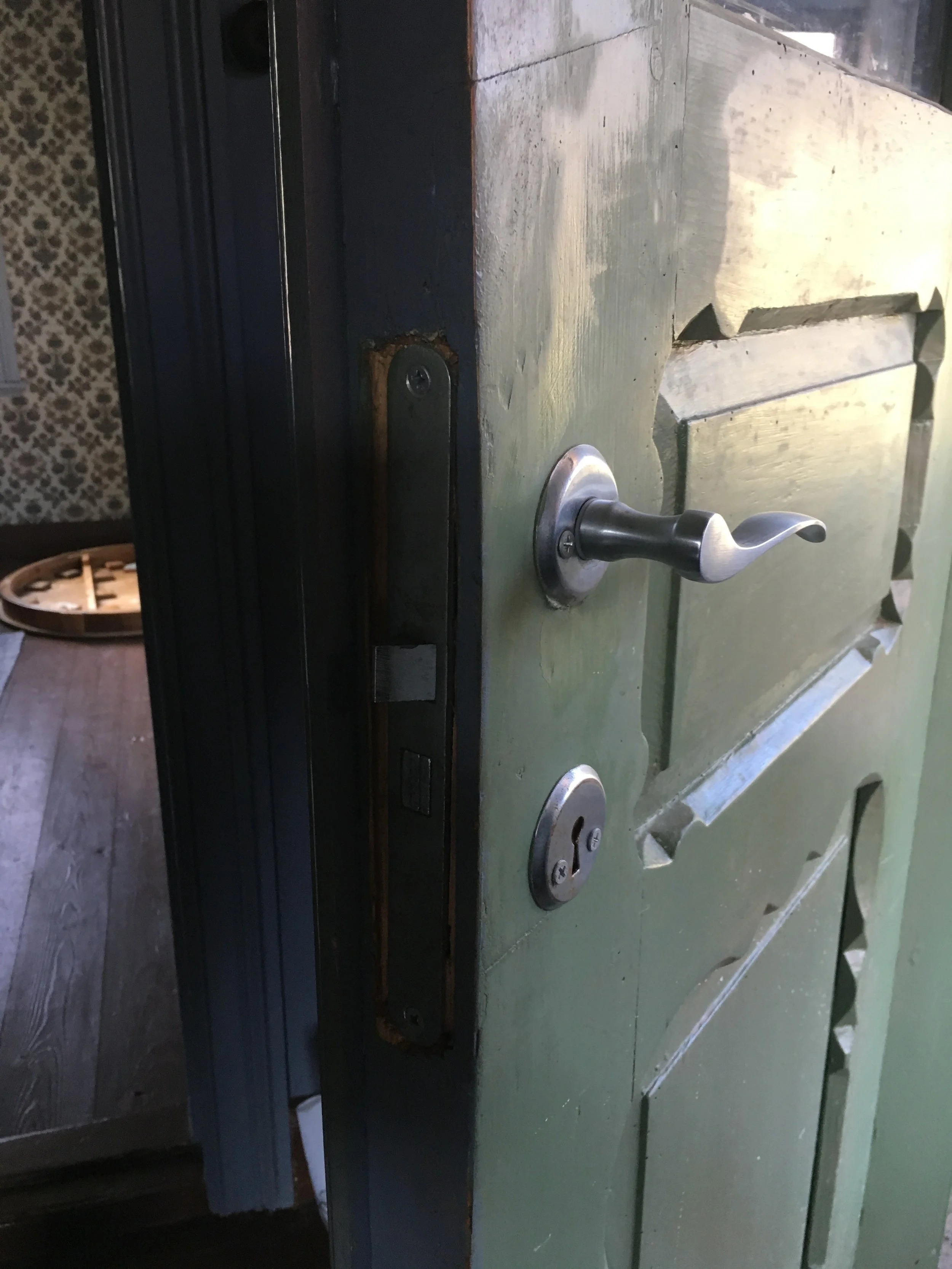 Front door with door handle to be changed.jpeg