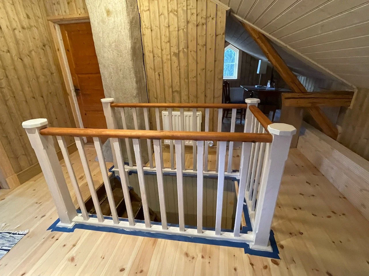 The railing stained with linseed oil after renovation in a 19th century old farm house