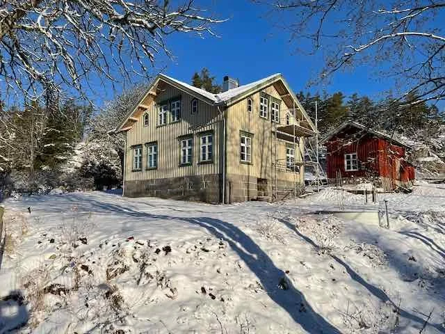 The farm house, in snow with scaffolding