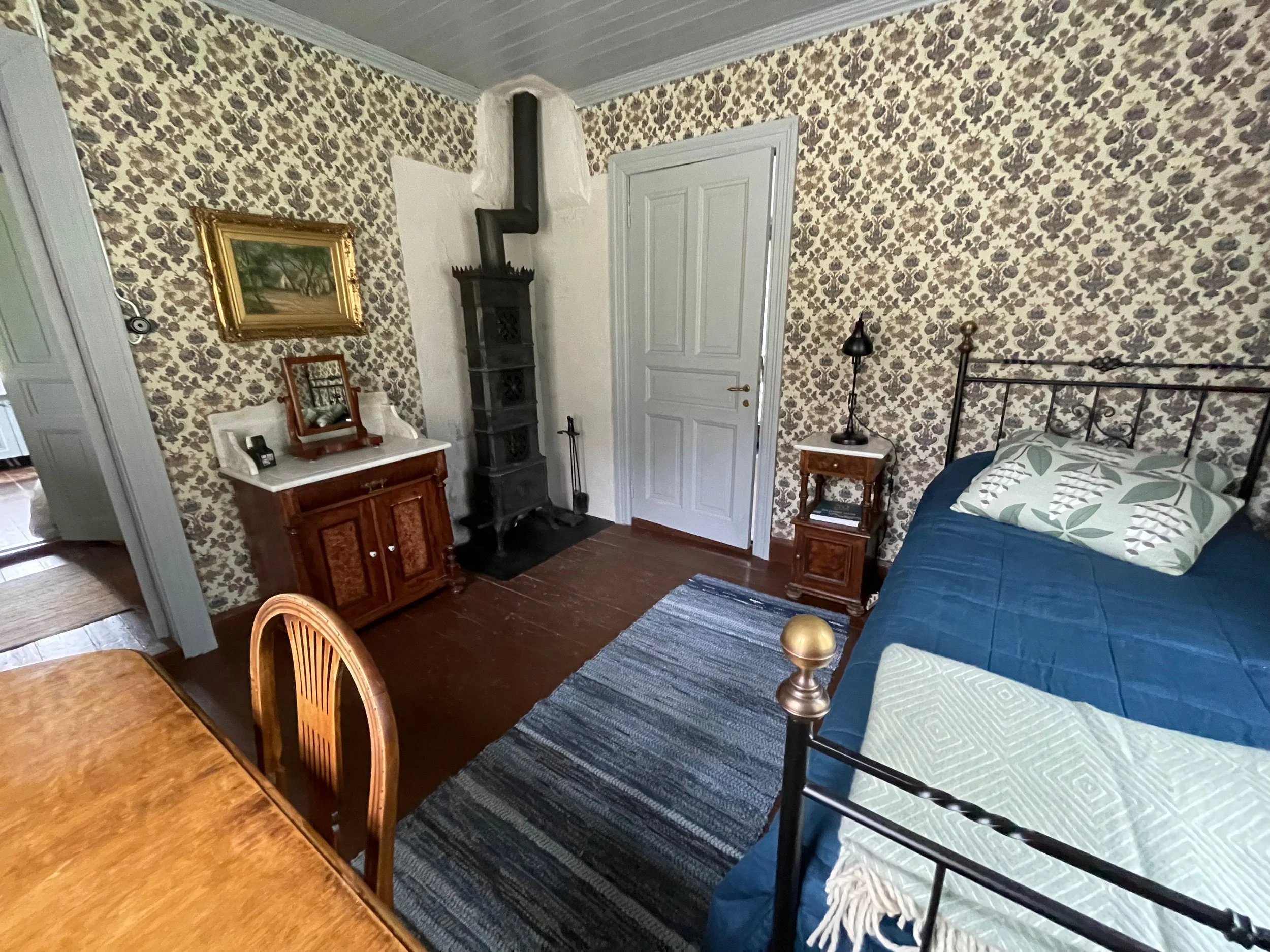 First floor guest room old Norwegian fire place