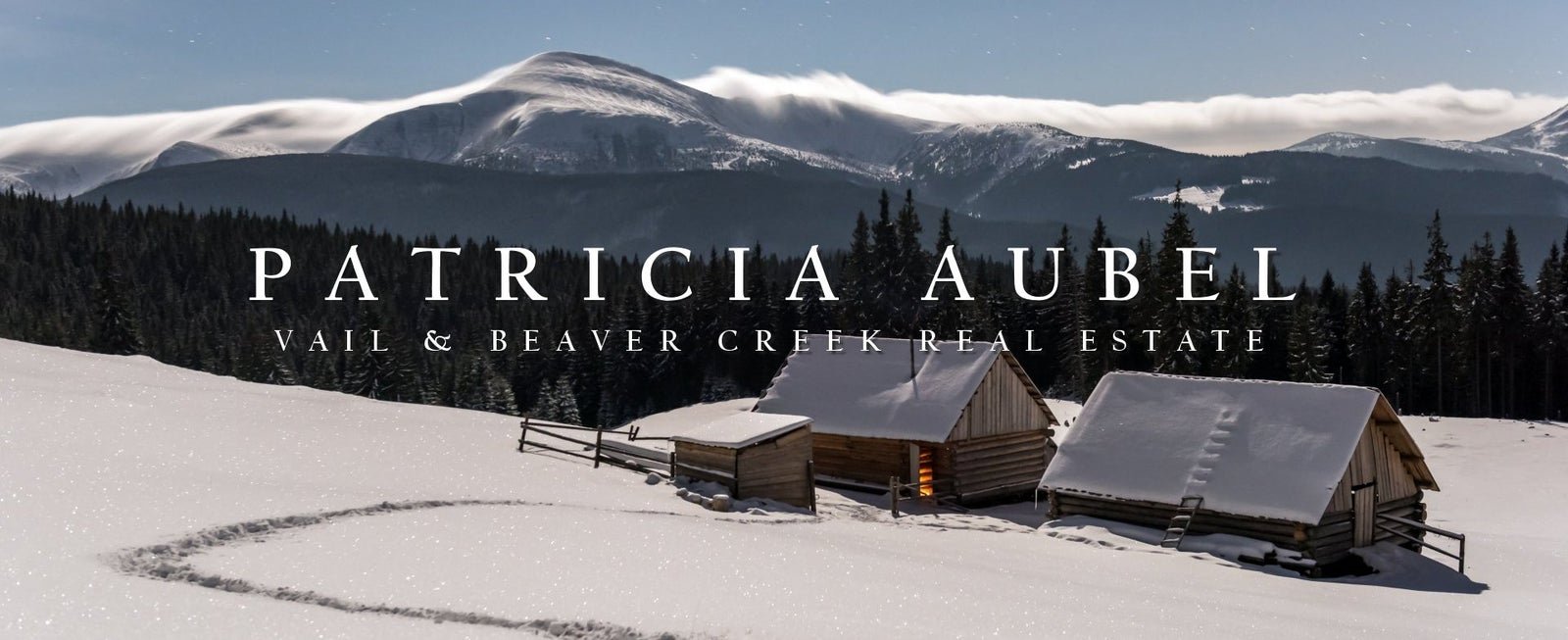 Snow-covered cabins in a mountain landscape with "Patricia Aubel Vail & Beaver Creek Real Estate" text overlay.