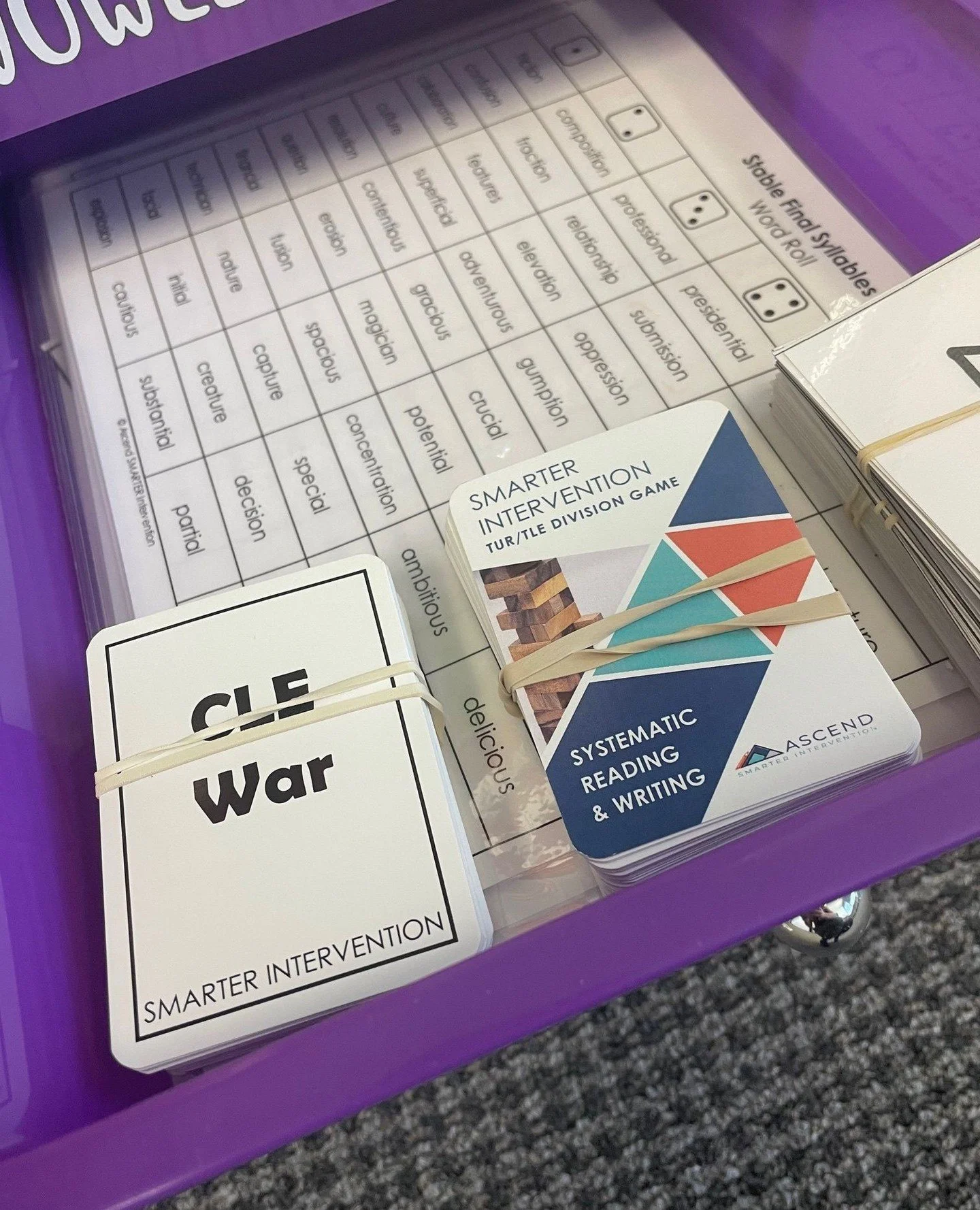 One of the best things we ever did in our literacy intervention was to organize our rainbow cart across the six syllable types so we could have ready-to-use games to help with concept reinforcement and review. That game cart is getting A LOT of use r