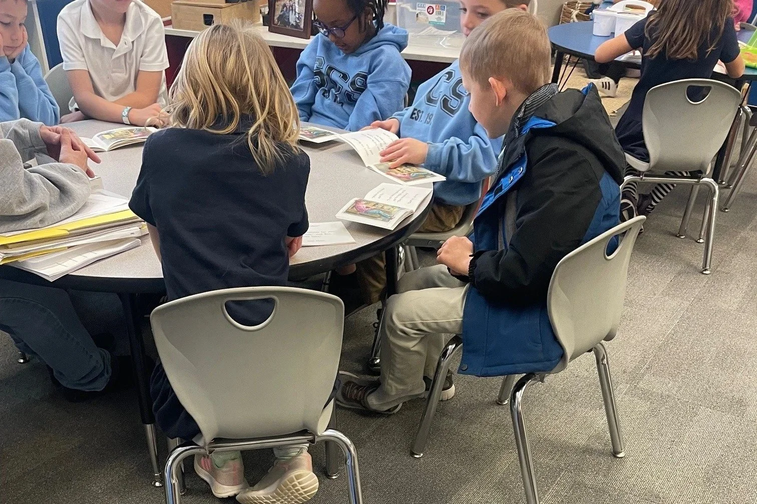 Students Working and reading at a classroom table