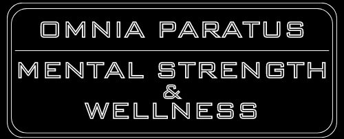 Black sign with white text that reads "OMNIA PARATUS MENTAL STRENGTH & WELLNESS."