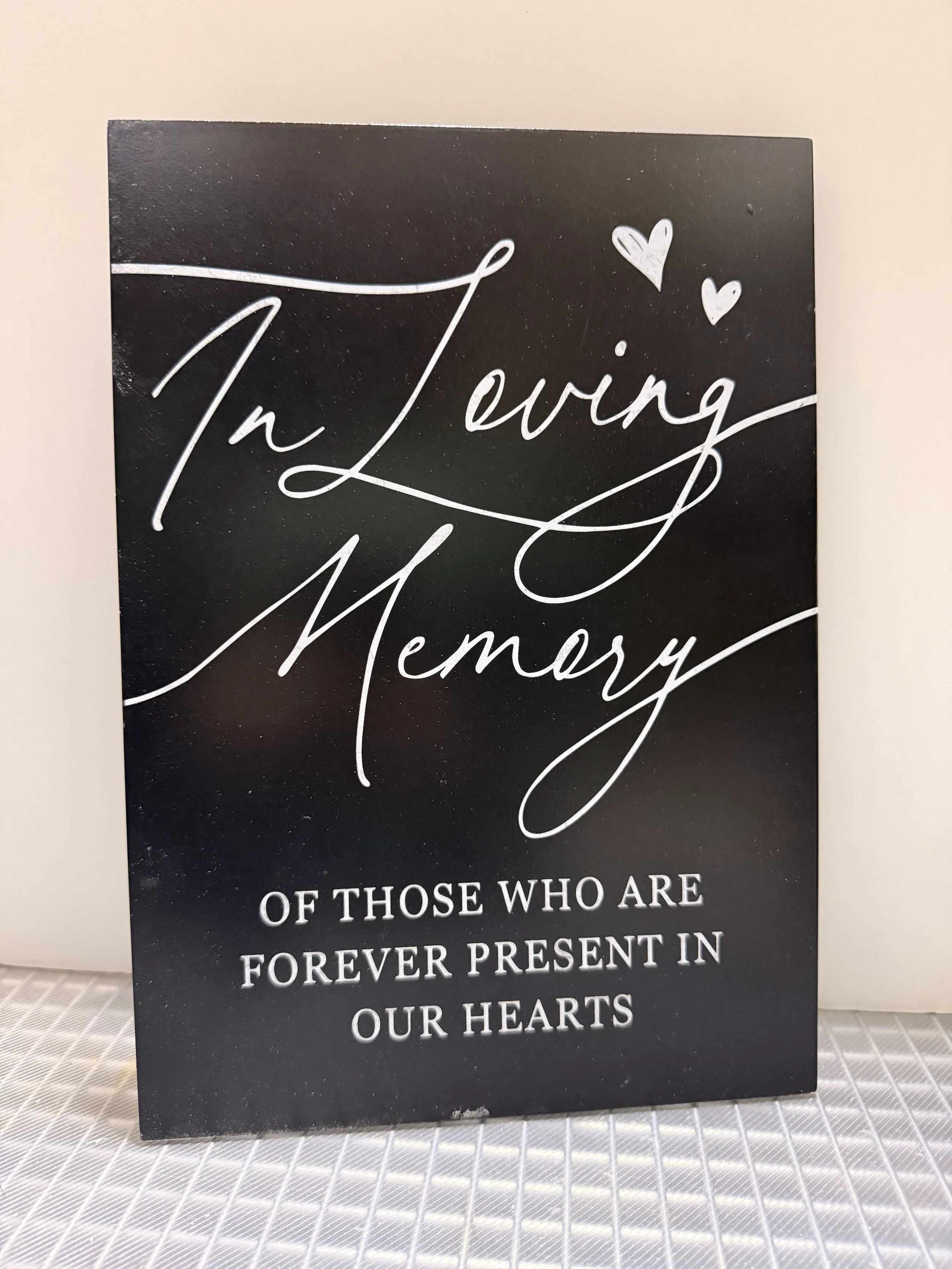 In Loving Memory black sign