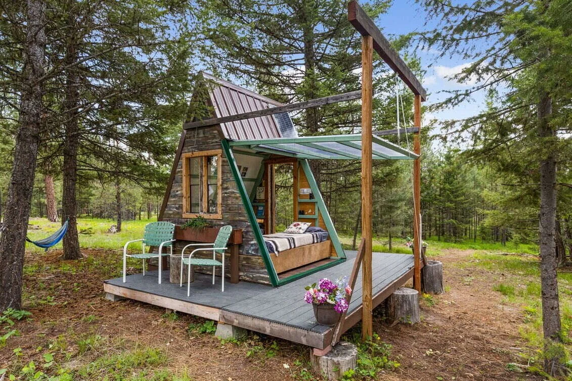 Hand-built A-frame glamping cabin with a rope-operated wall at The Hohnstead near Missoula Montana.