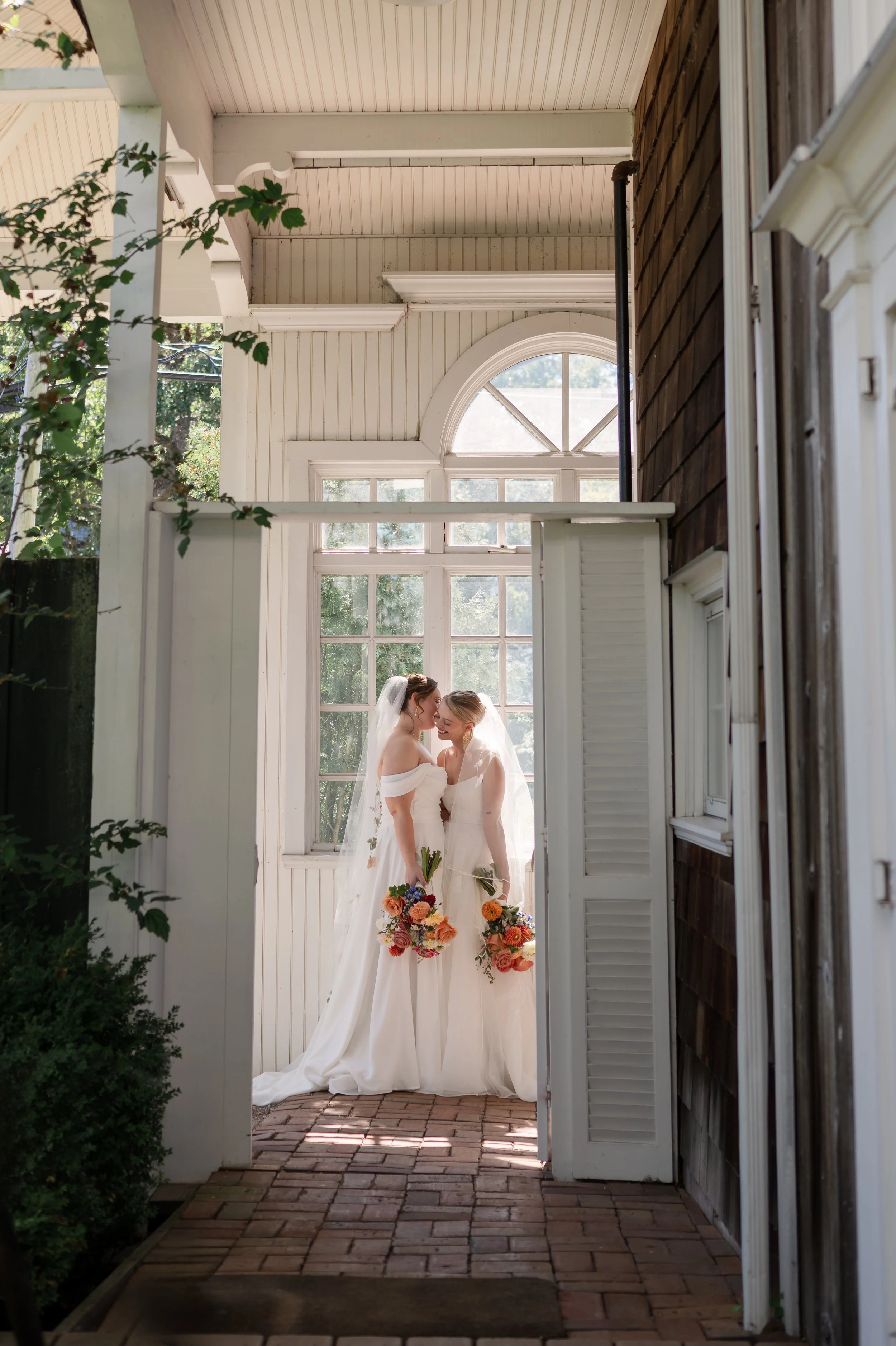 LGBTQ Brides in a gorgeous photo session on their wedding day on the Delaware river in New Jersey