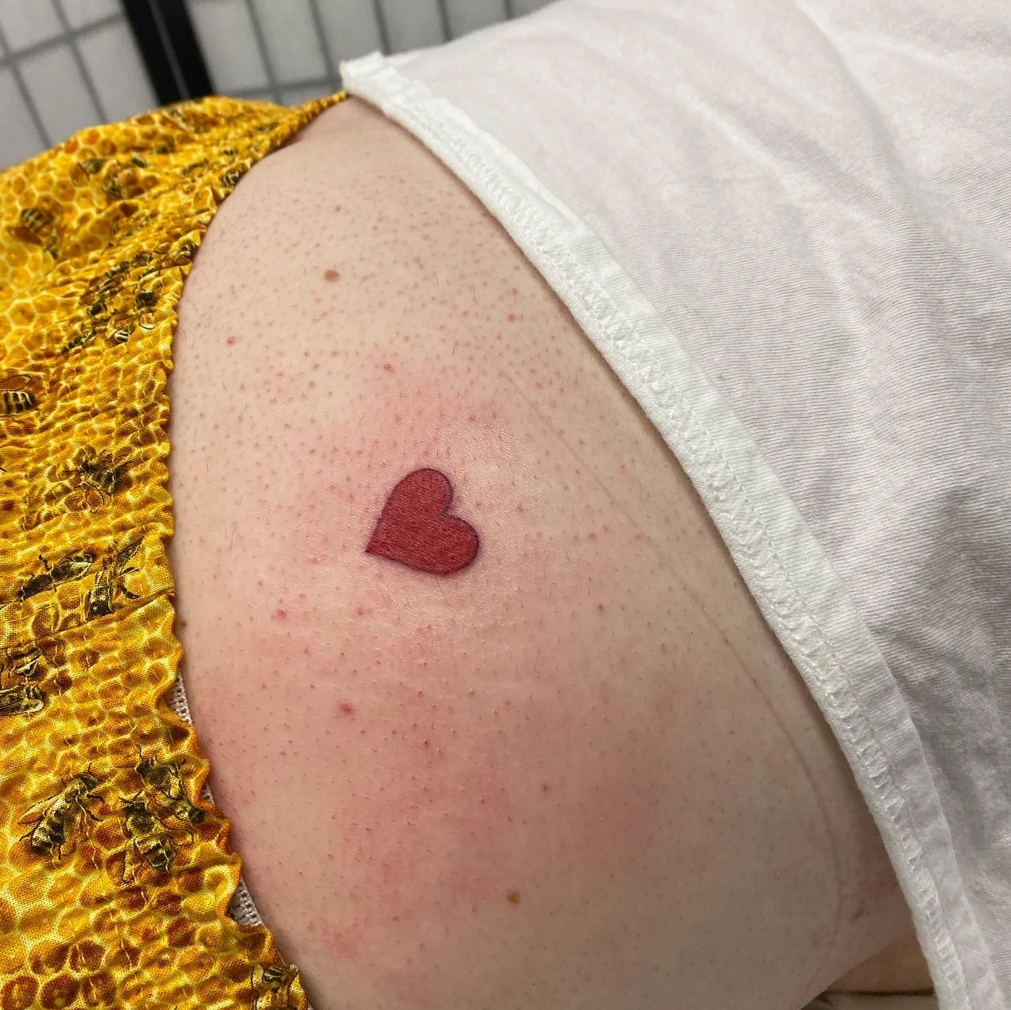 My Care-Bear inspired heart tattoo .