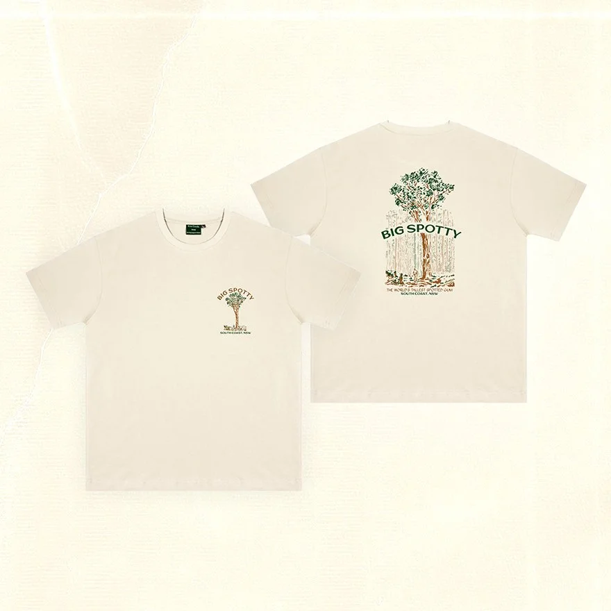 Two cream Big Spotty graphic T-shirts displayed front and back, featuring a tall tree illustration and text.