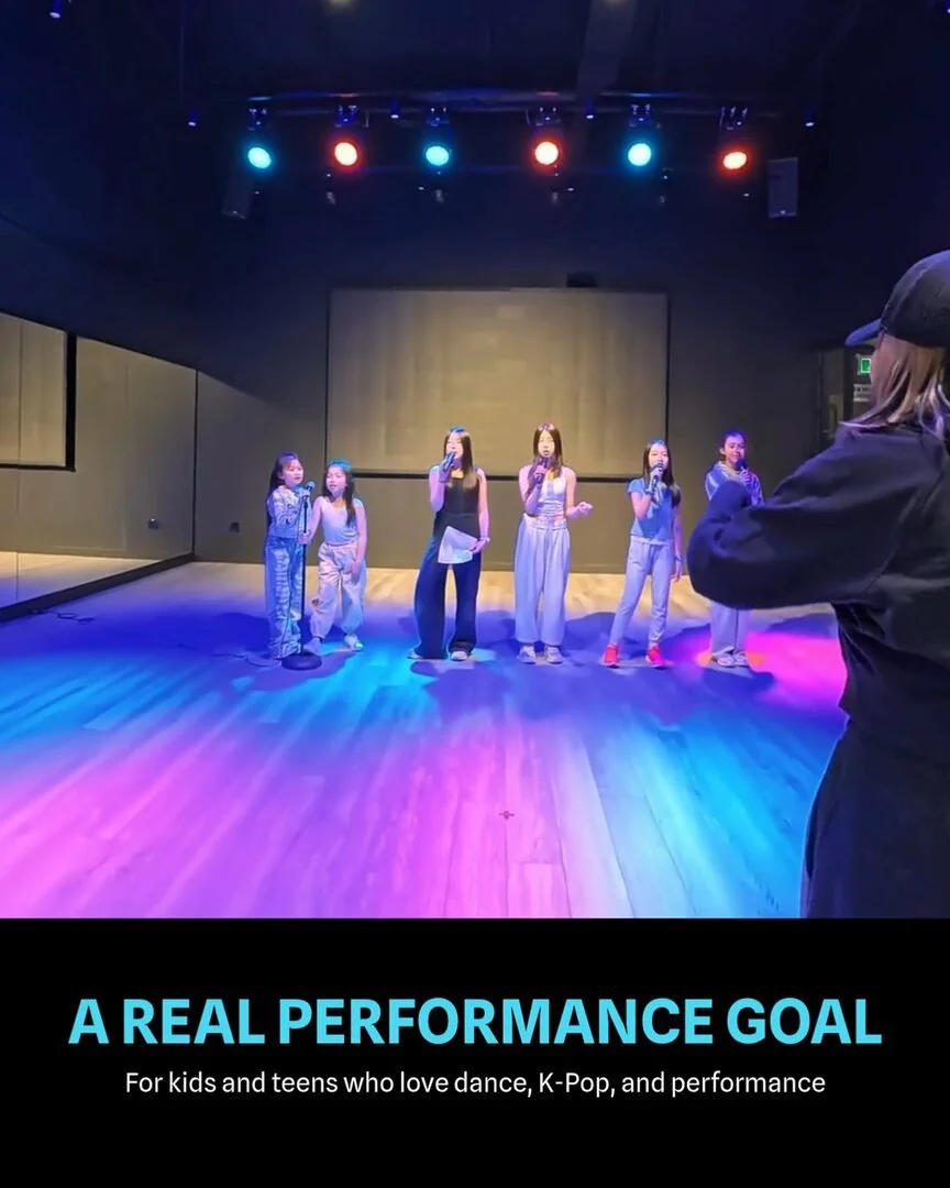 Post: a wide shot of a class rehearsing on the studio floor, seen from behind the teacher, with the words A real performance goal.
