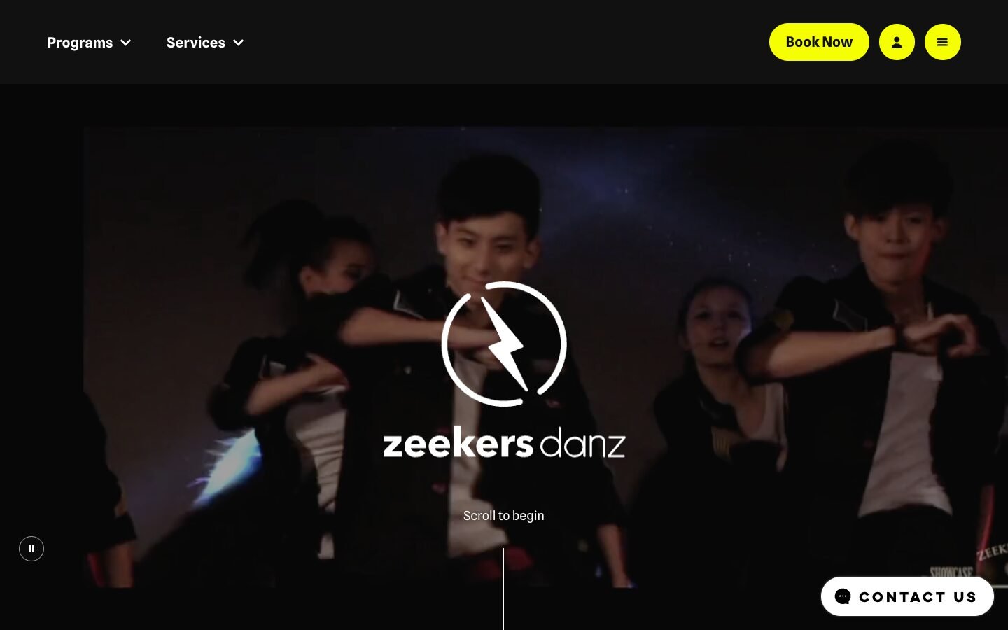 The home page of the revamped ZeekersDanz website on a desktop screen: the zeekers danz logo over a dark dance video, with Programs and Services menus and a yellow Book Now button.
