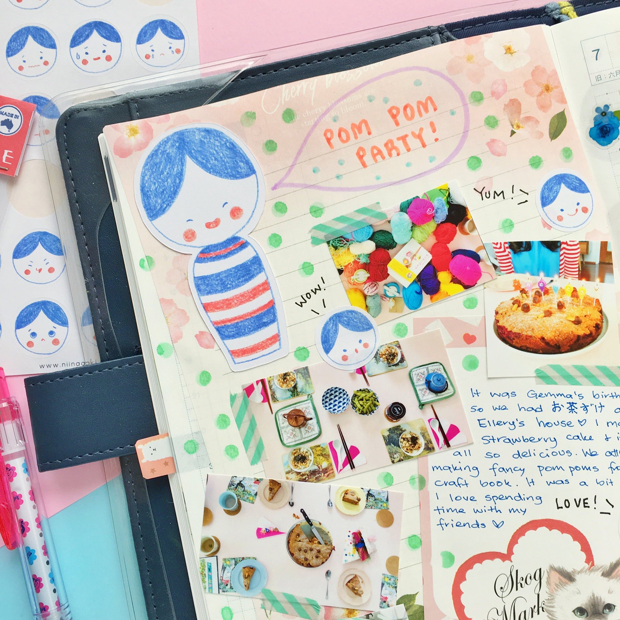 Die cut kokeshi doll note cards stuck on a journal page
