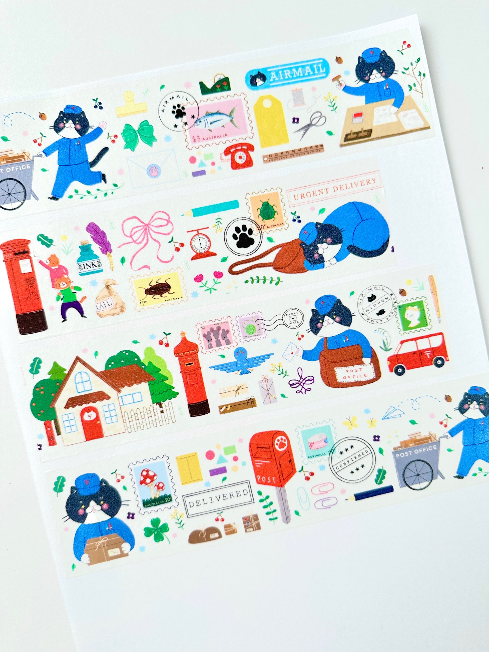 paper washi tape of a postman cat delivering mail
