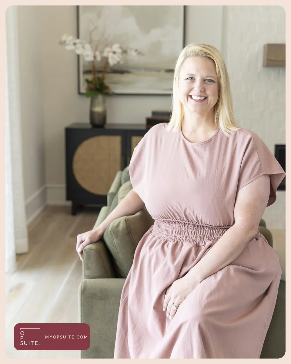 Samantha Cox in a pink dress seated on a sofa in a Jacksonville home, smiling