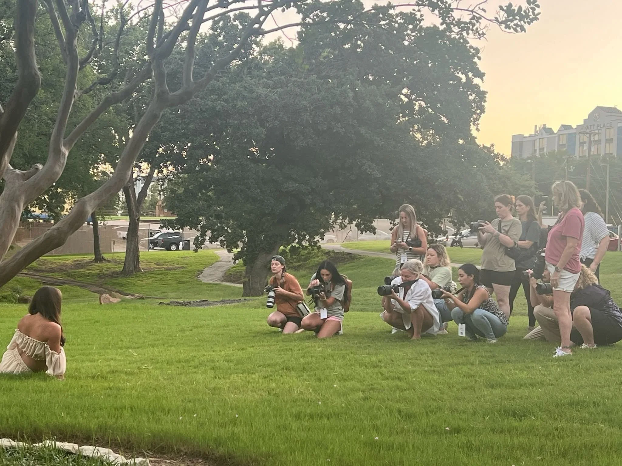 Maternity photographers outside learning how to pose and photograph a pregnant mom at the Maternity and Newborn Photographers Summit 2025