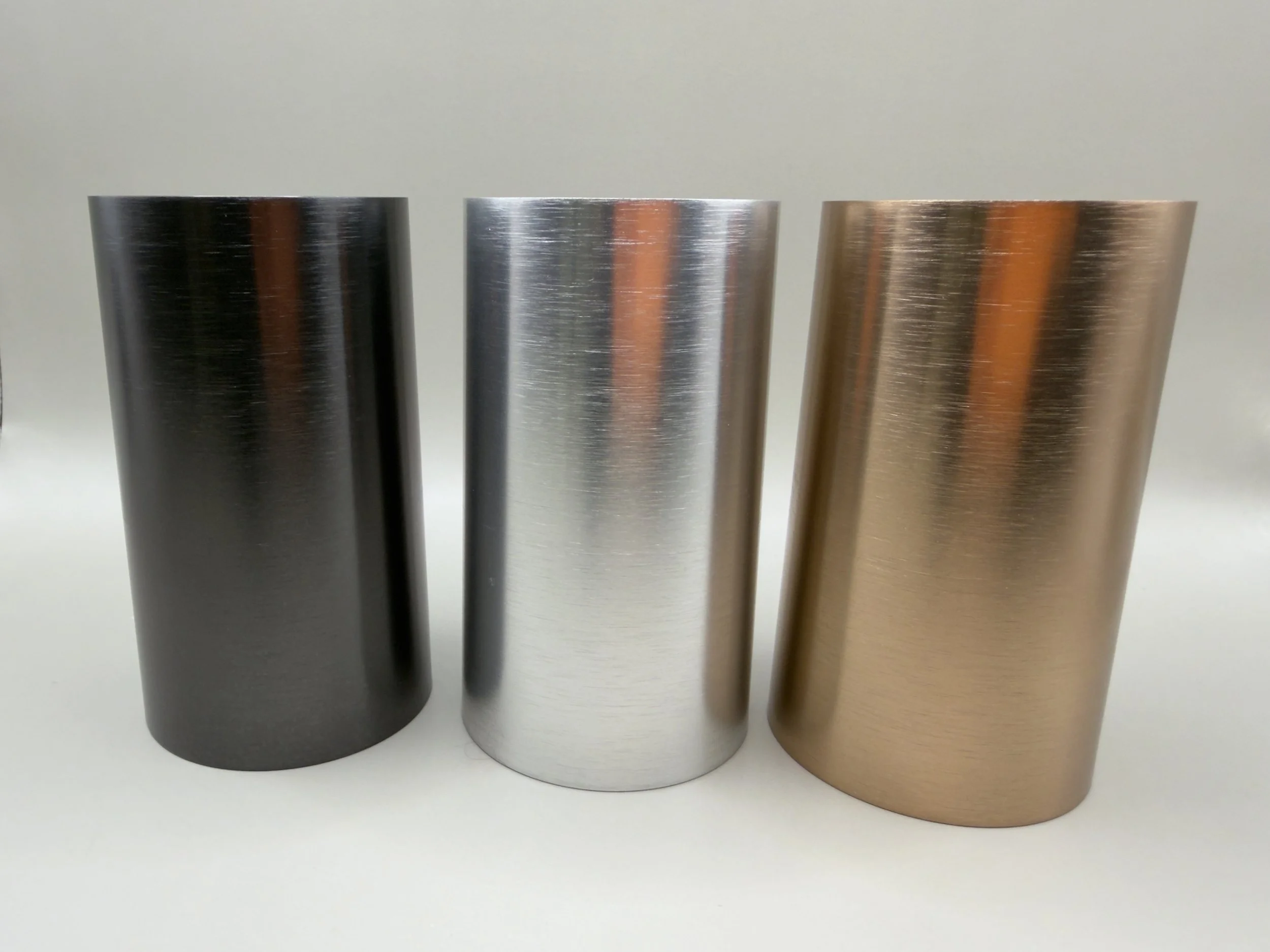 Anodized tubes with brussed surface and chemical polish treatment