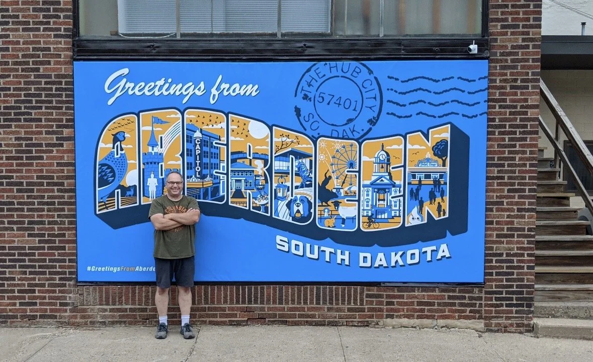 Troy infront of the Aberdeen sign